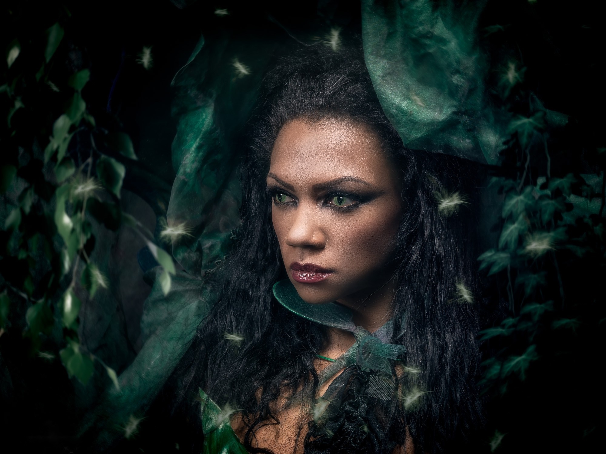 Woman with green eyes in a dark forest HD Wallpaper