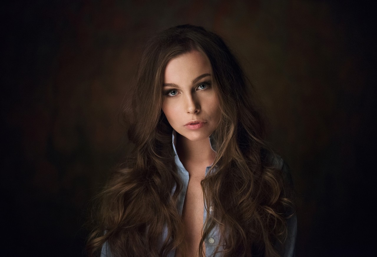 Woman with long brown hair wearing a blue shirt HD Wallpaper