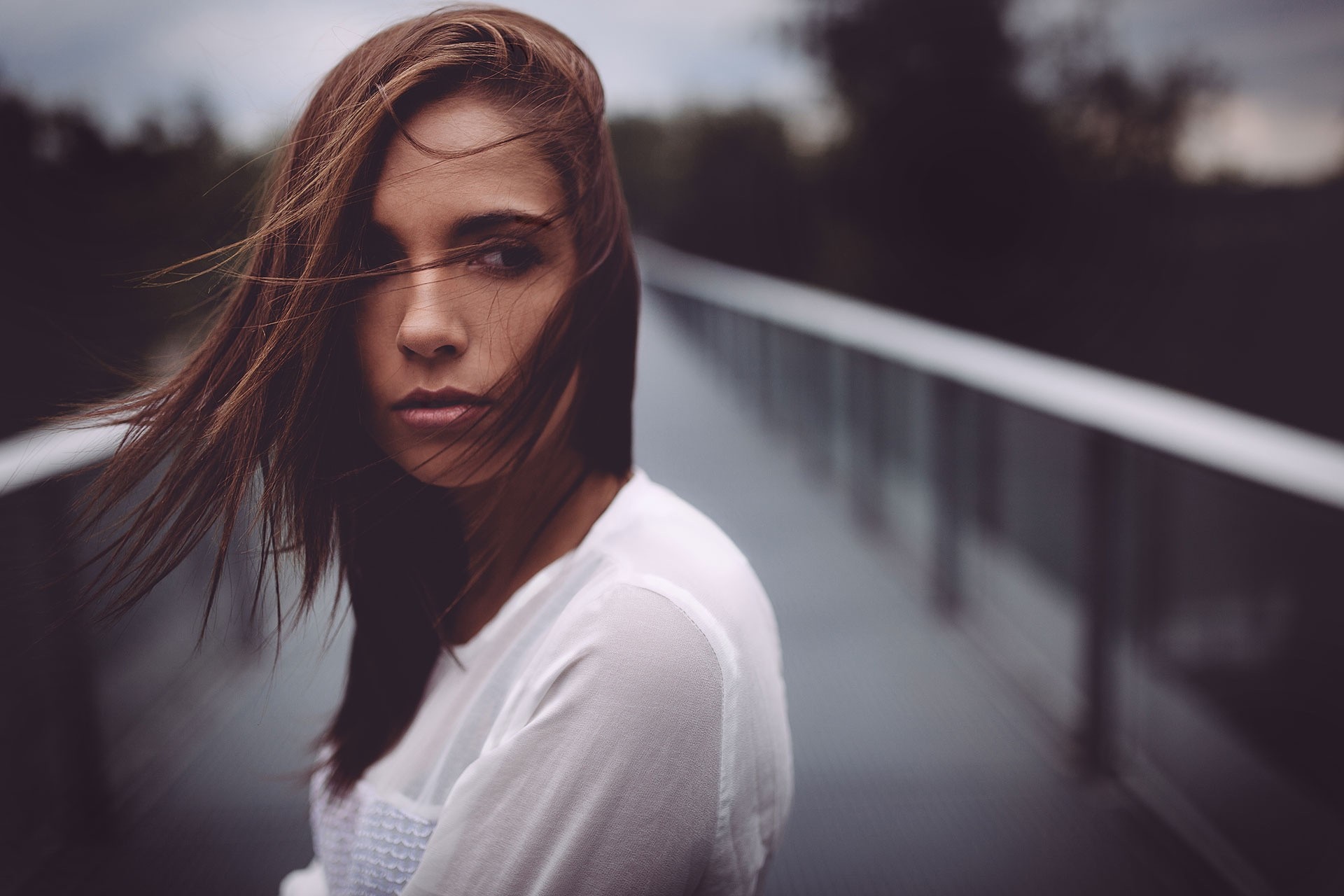Woman with brown hair on a bridge HD Wallpaper