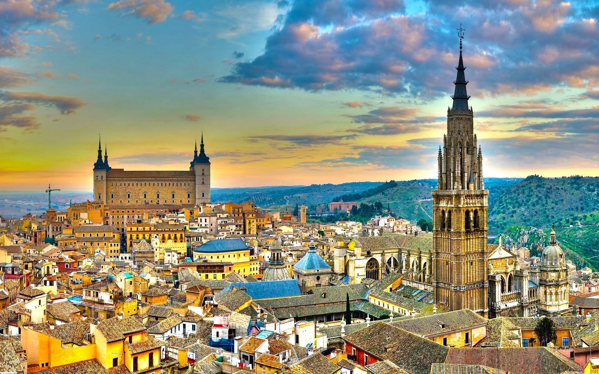 Toledo cityscape with cathedral and Alcázar at sunset HD Wallpaper