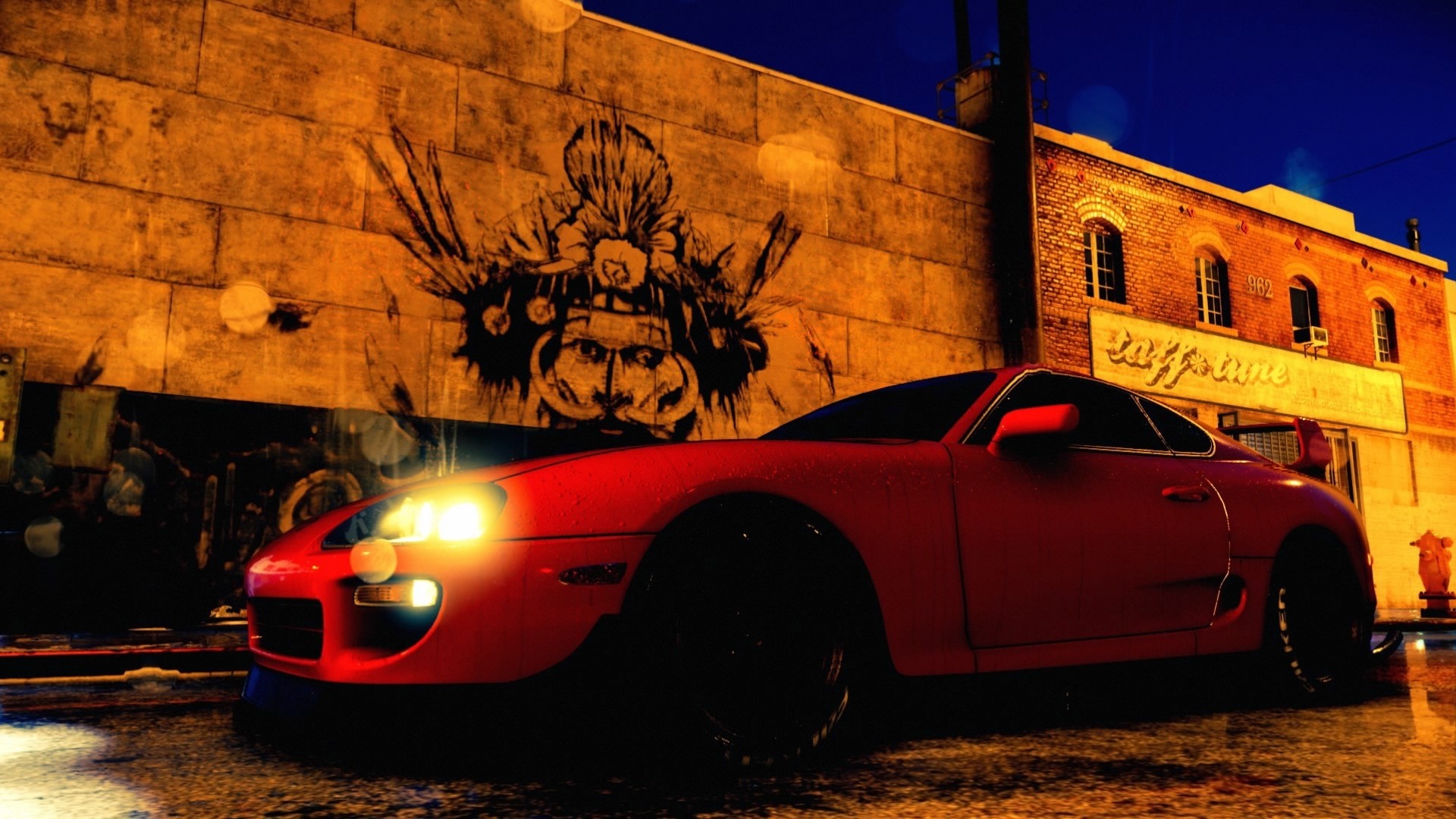 Red Toyota Supra parked by graffiti wall at night HD Wallpaper