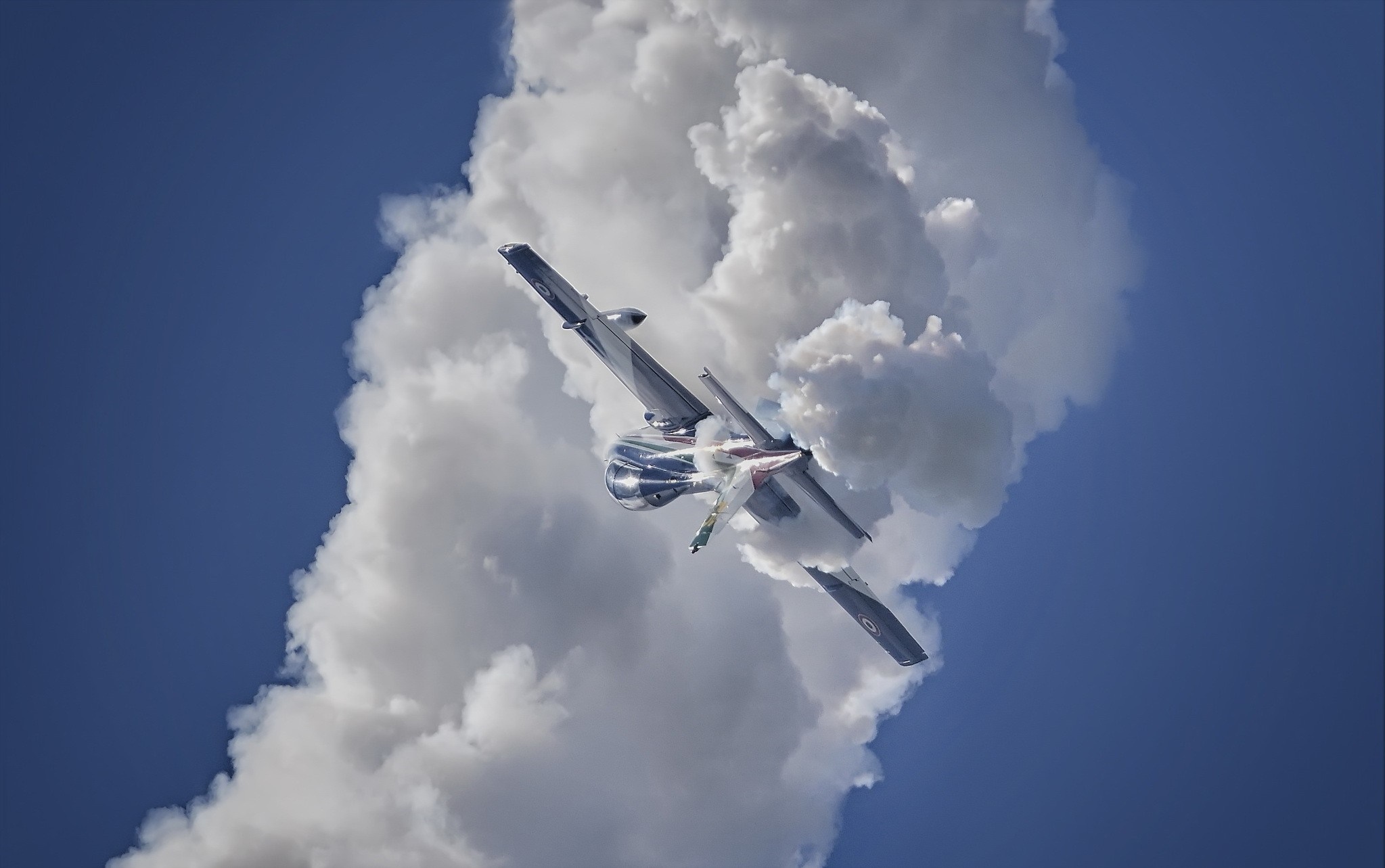 Aermacchi MB-339 performing aerobatics in a cloudy sky HD Wallpaper