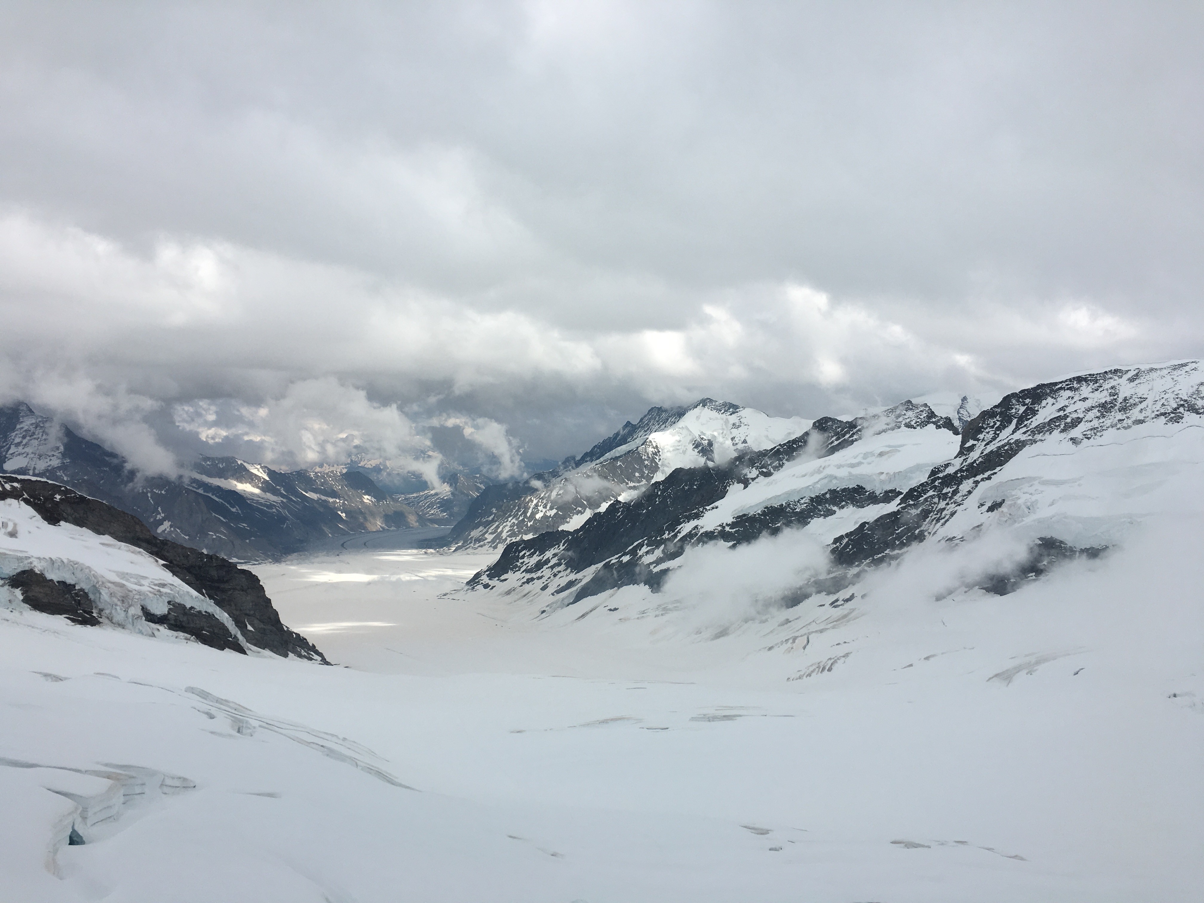 Snowy mountain range with clouds HD Wallpaper