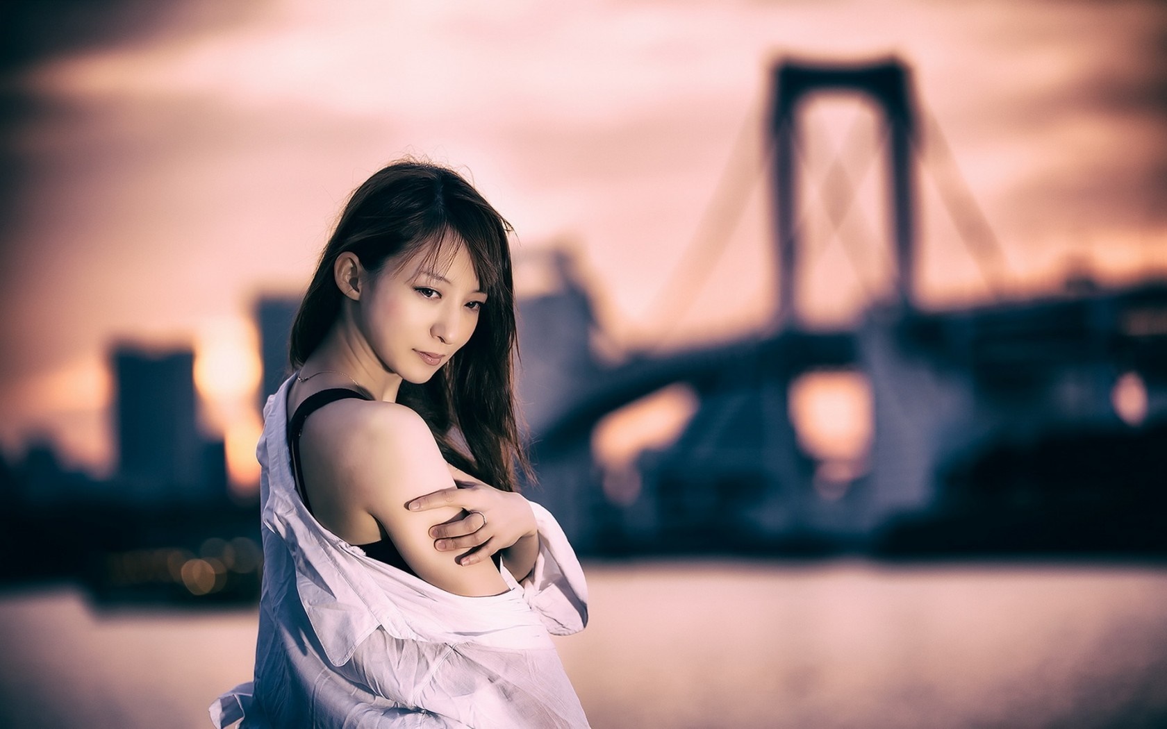Woman in white shirt with bridge in background HD Wallpaper
