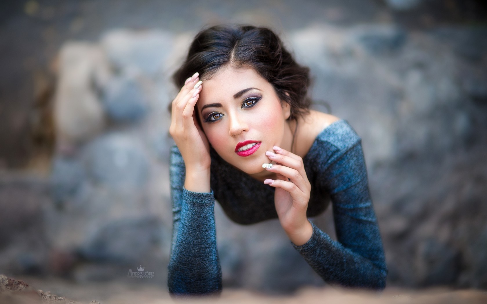 Woman with dark hair and makeup posing HD Wallpaper