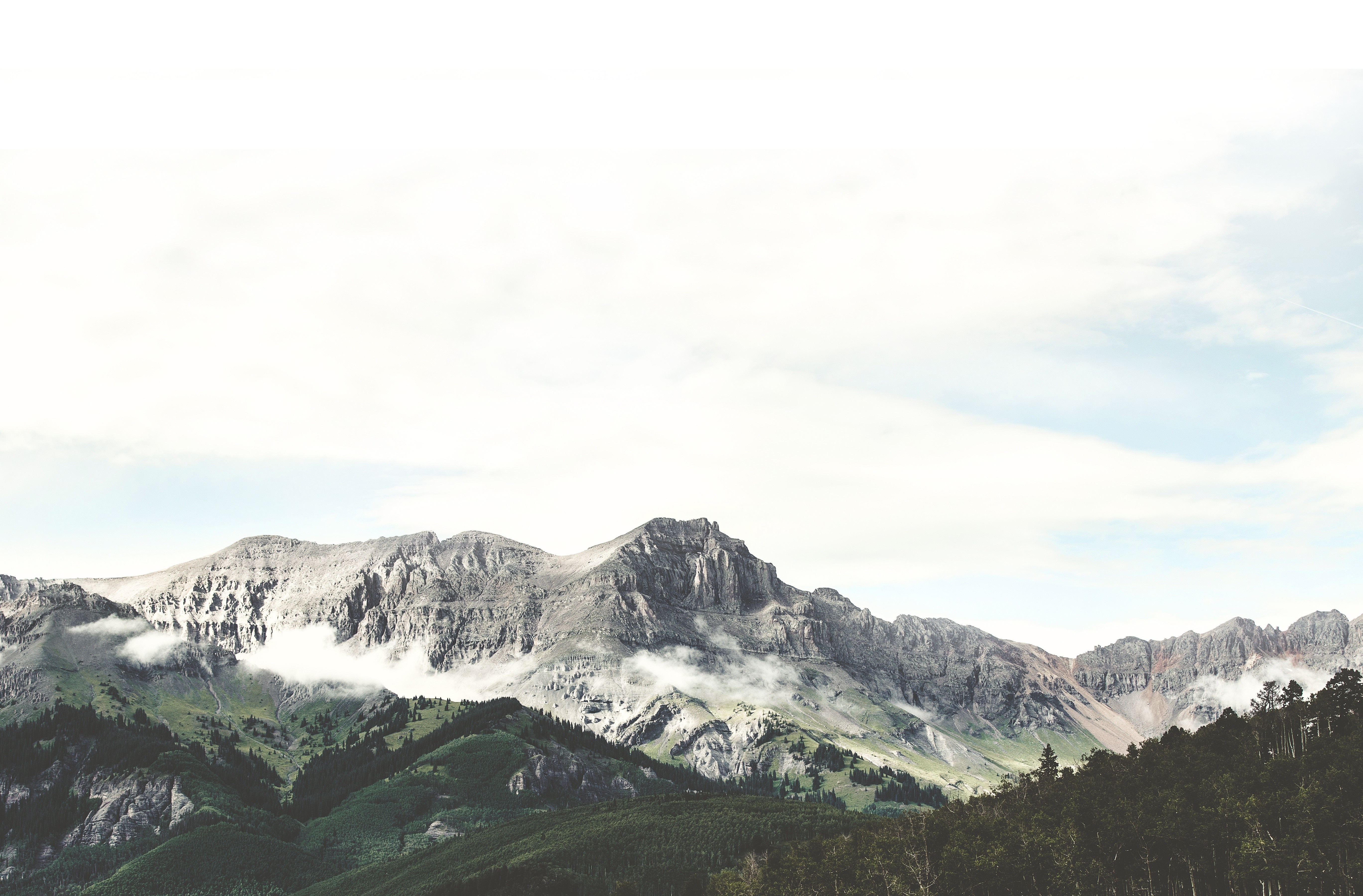 Mountain range with clouds and trees HD Wallpaper