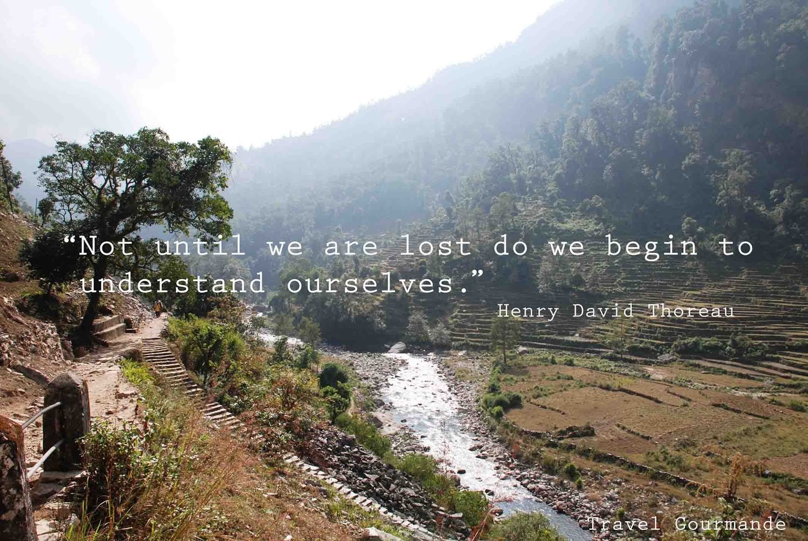 Henry David Thoreau quote over mountain valley HD Wallpaper
