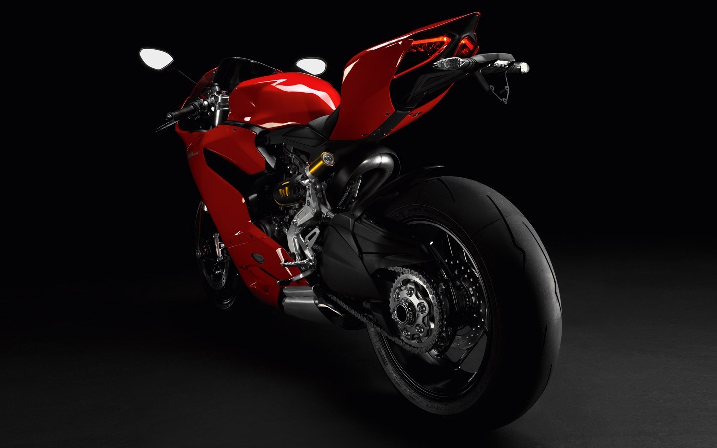 Red Ducati motorcycle with black background HD Wallpaper