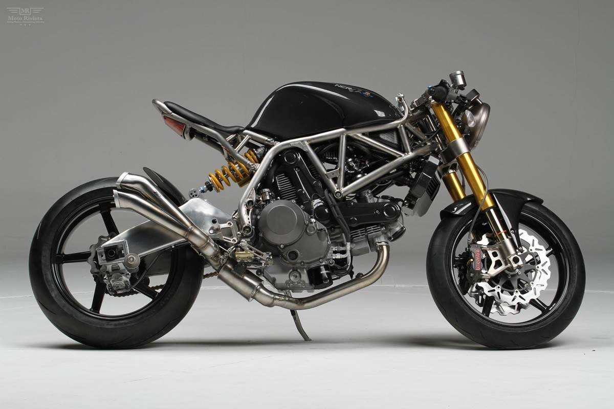 Custom Ducati motorcycle with exposed frame and dual exhaust HD Wallpaper