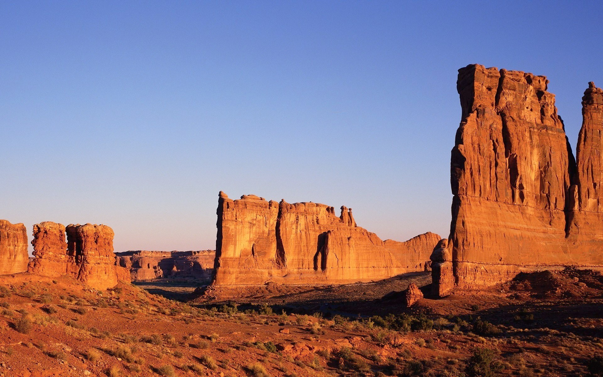 Desert landscape with sandstone rock formations at sunset HD Wallpaper