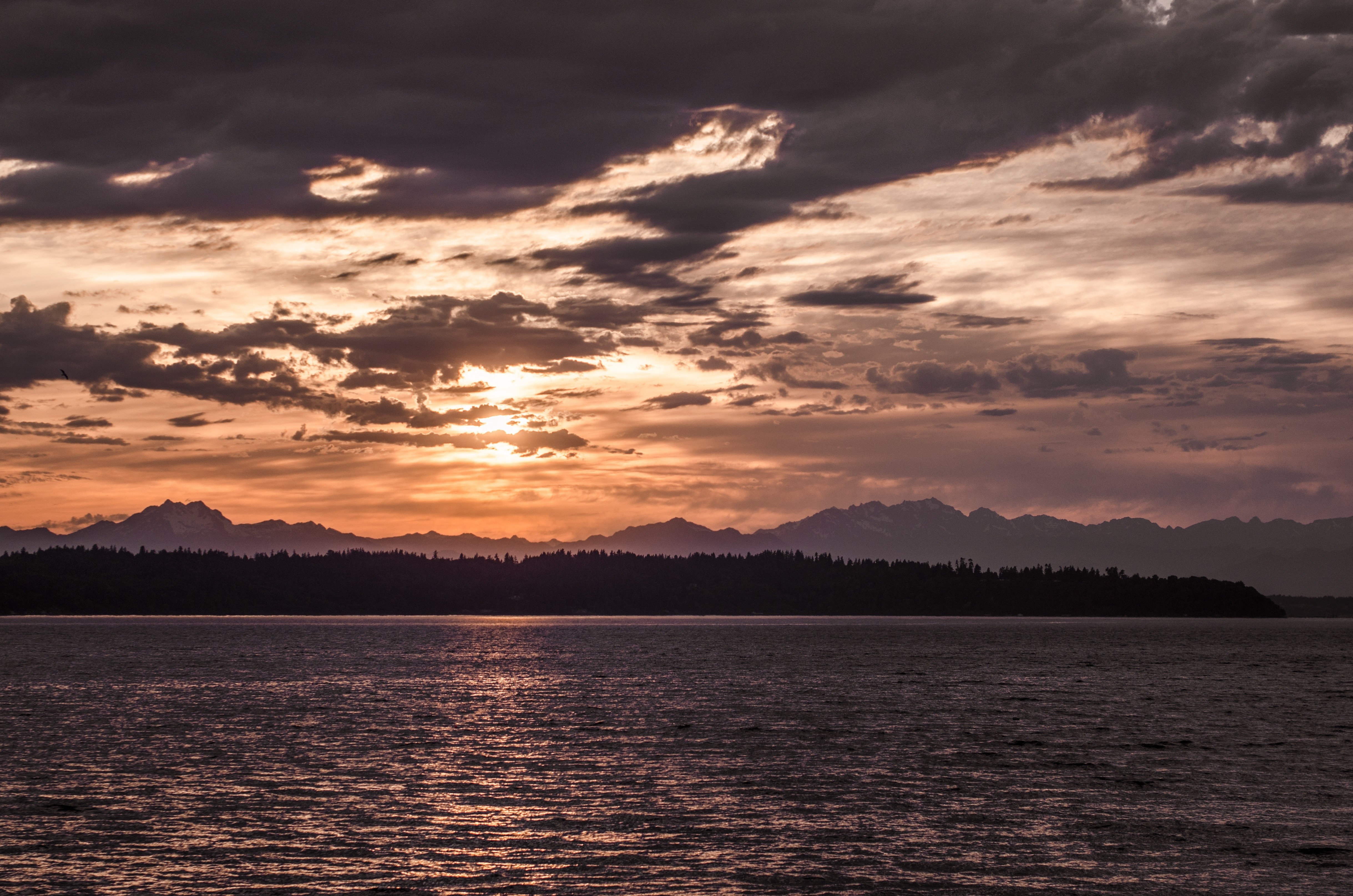 Sunset over mountains and sea HD Wallpaper
