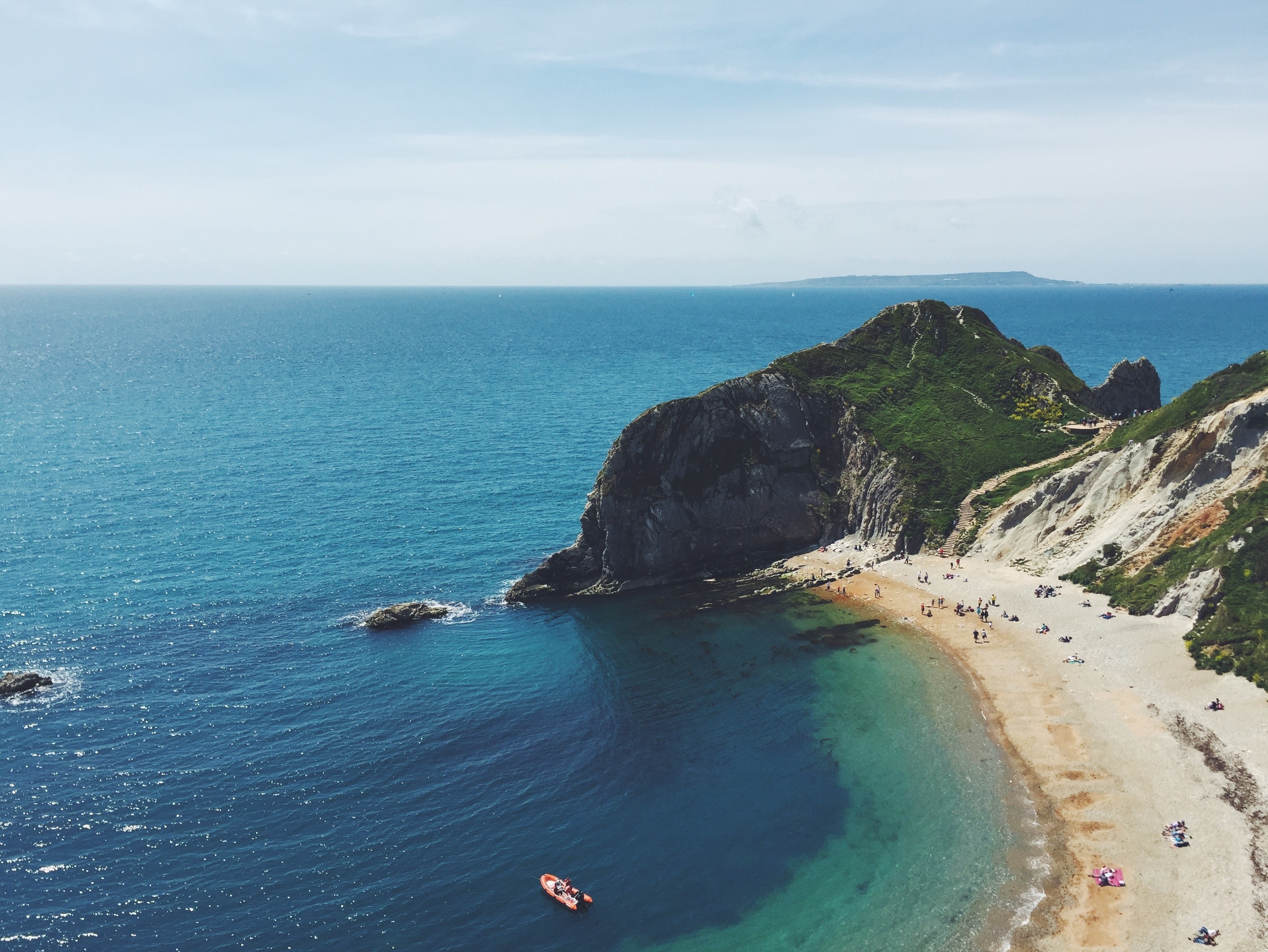 Scenic coastal bay with cliffs and beach HD Wallpaper