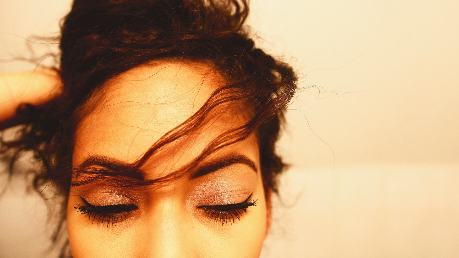Close up of a woman's face with eyes closed HD Wallpaper