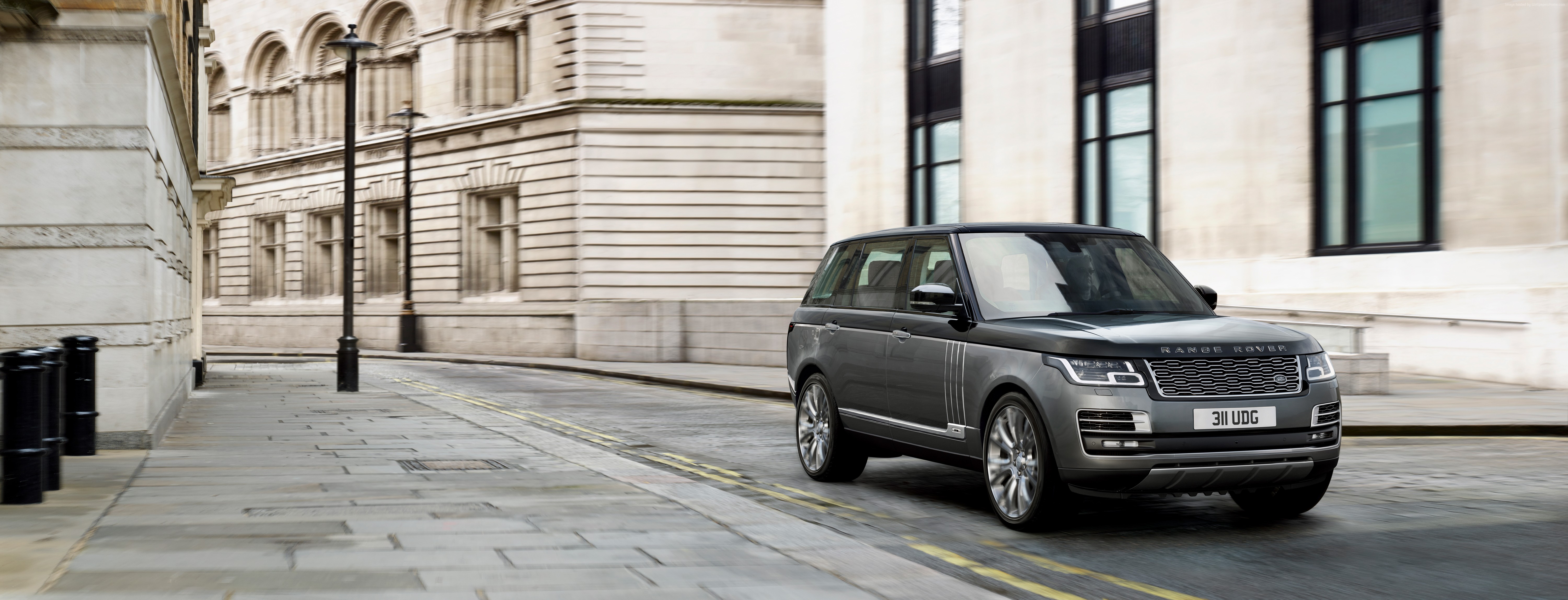 Range Rover SVAutobiography driving on a city street HD Wallpaper