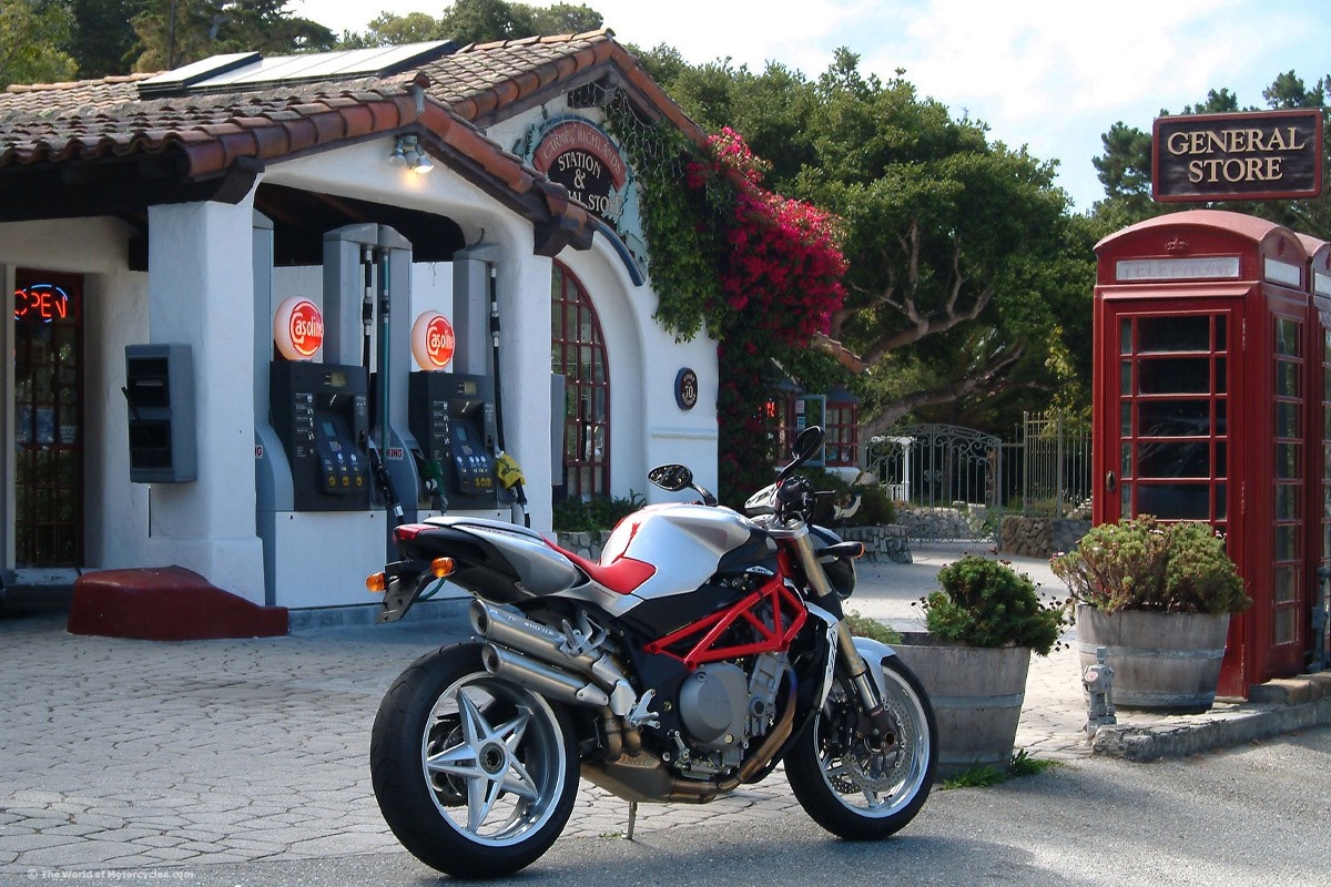MV Agusta motorcycle at a vintage gas station and general store HD Wallpaper