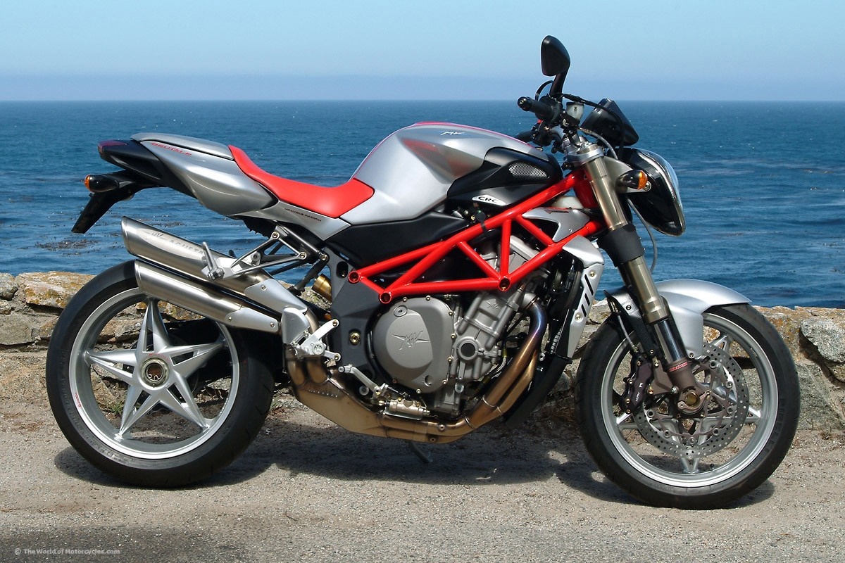 MV Agusta motorcycle parked by the ocean HD Wallpaper