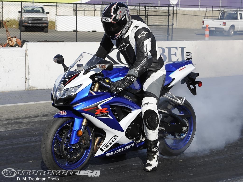 Suzuki motorcycle rider performing a burnout HD Wallpaper