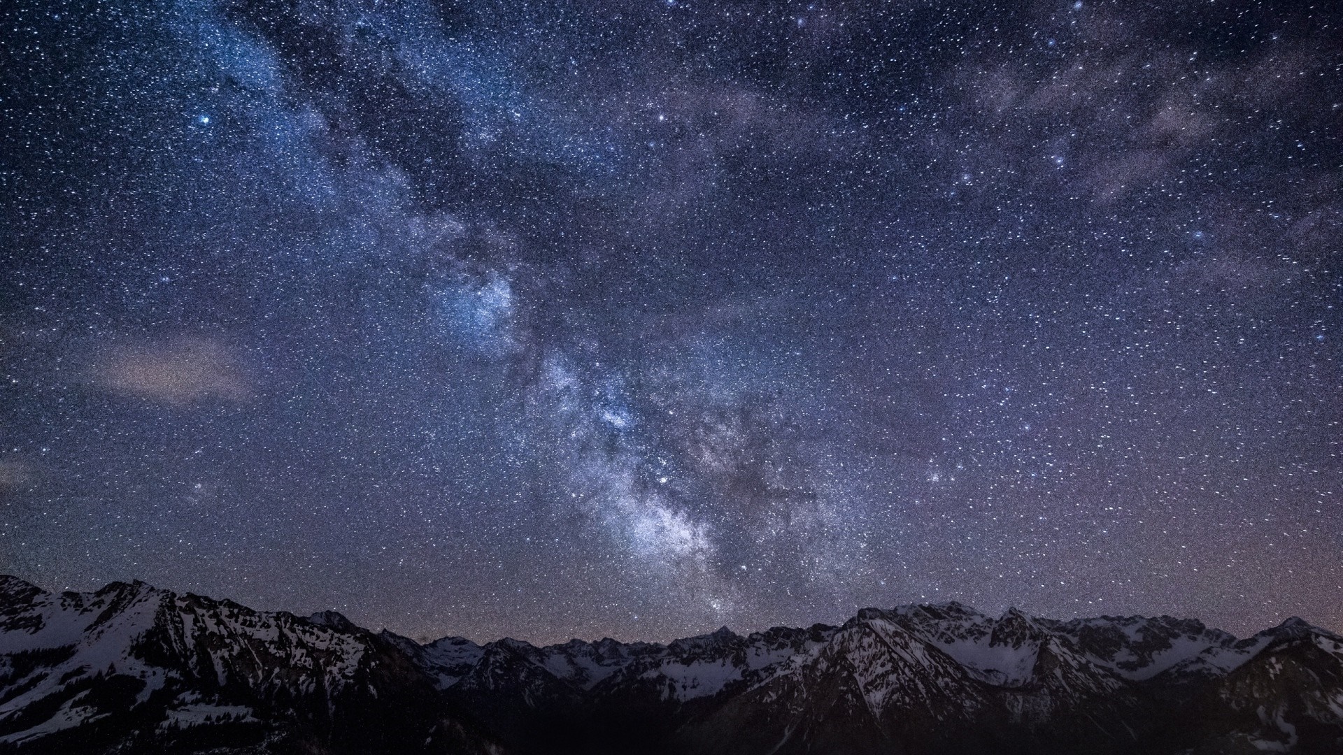 Milky Way Galaxy over snow-capped mountains at night HD Wallpaper