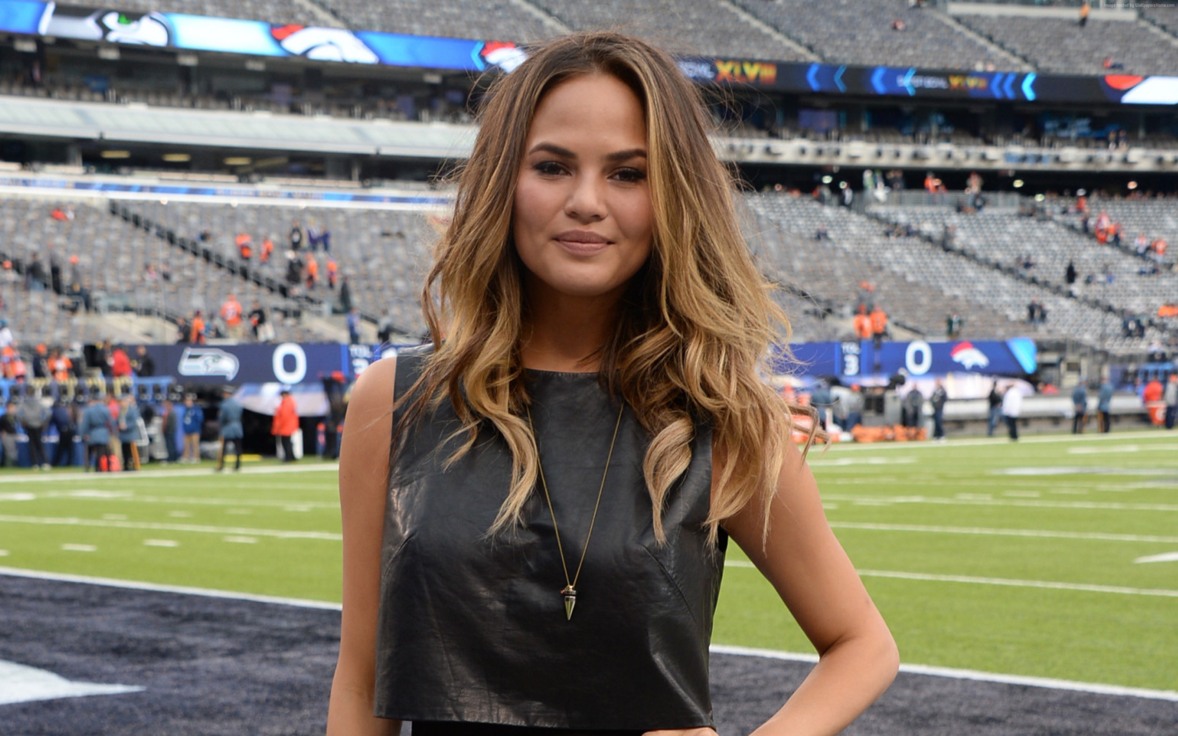 Chrissy Teigen at a Football Stadium HD Wallpaper