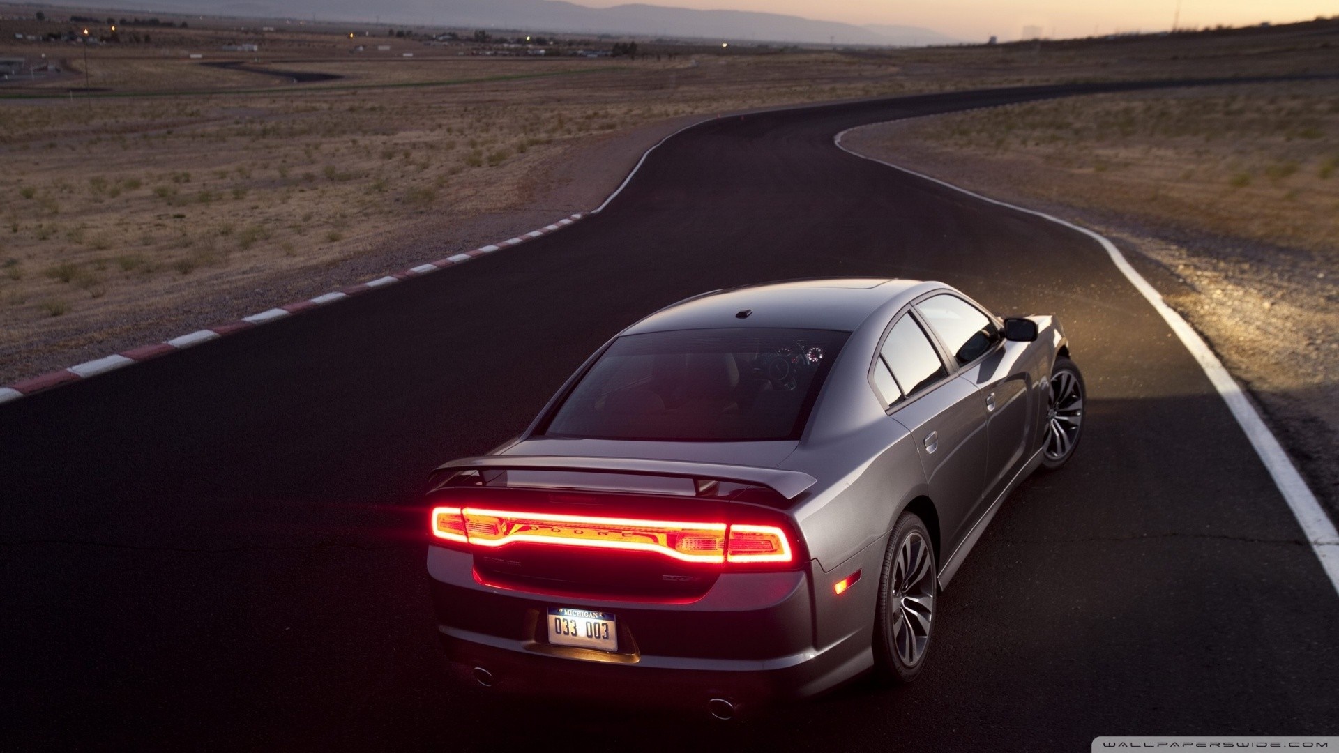 Gray Dodge Charger on a Racetrack at Dusk HD Wallpaper