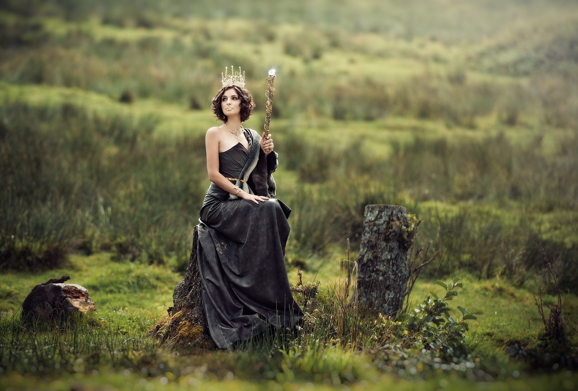 Woman in a dark gown and crown holding a staff HD Wallpaper