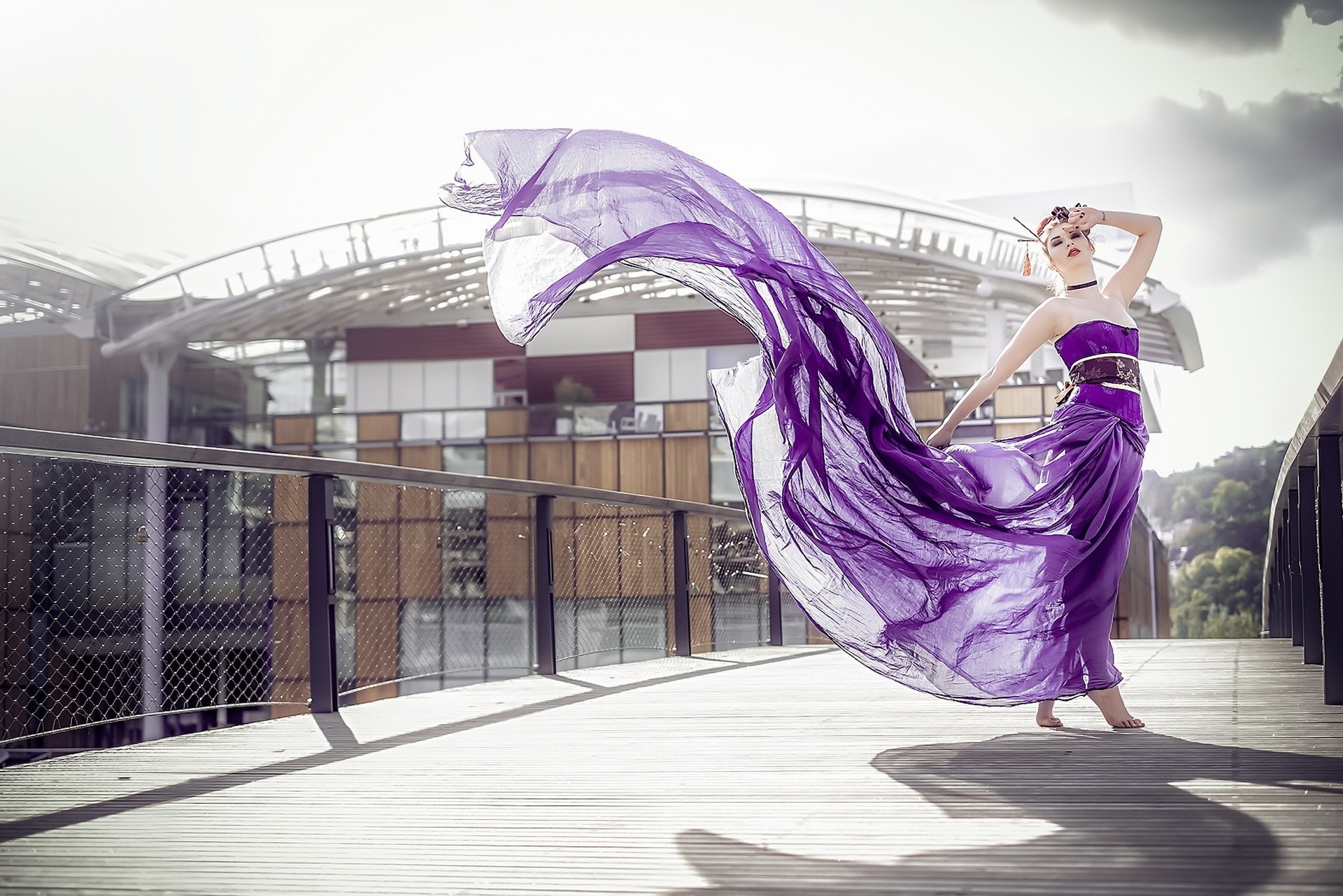 Woman in purple dress on a bridge HD Wallpaper
