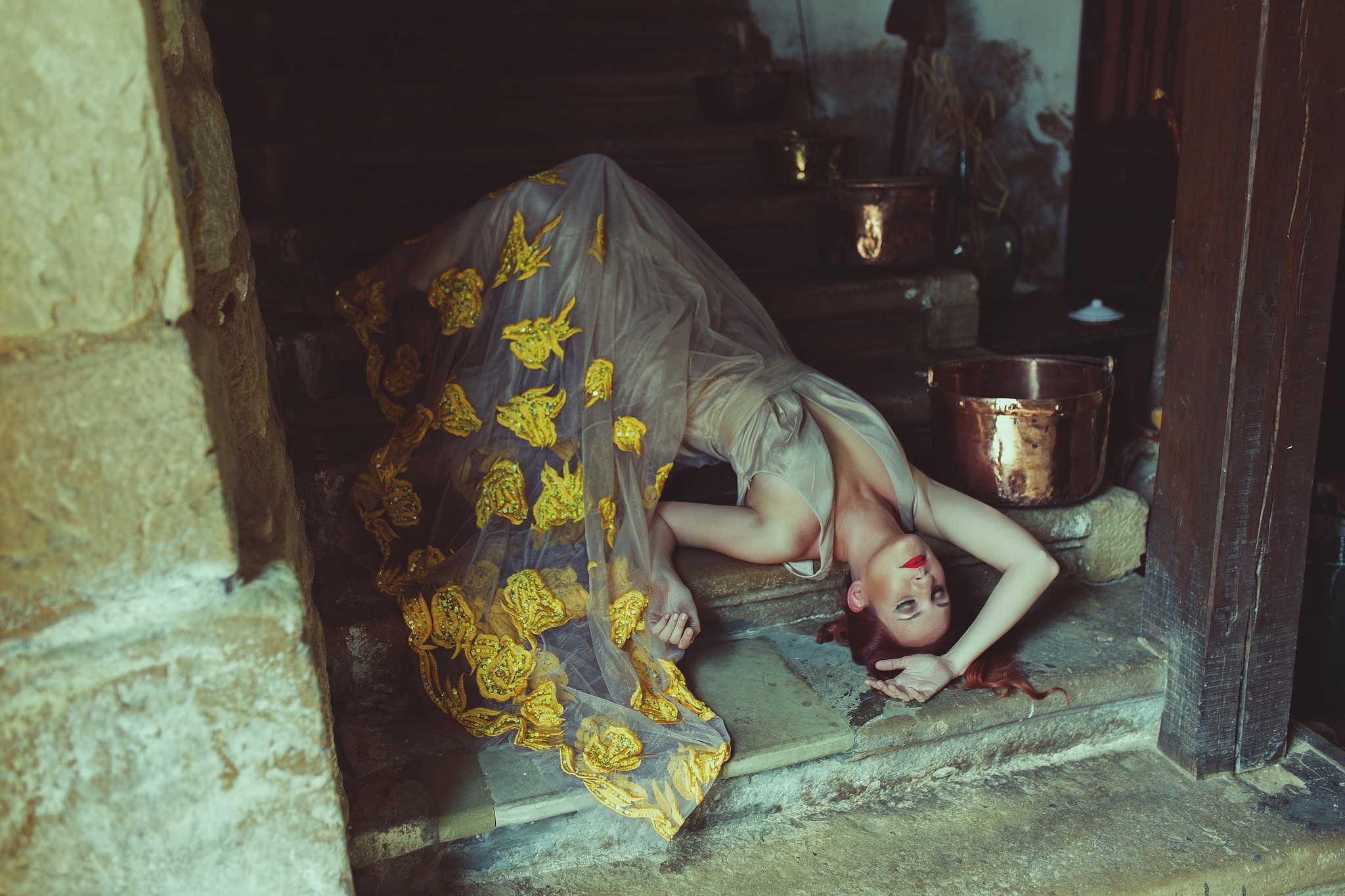 Woman in ornate dress lying on stone steps HD Wallpaper