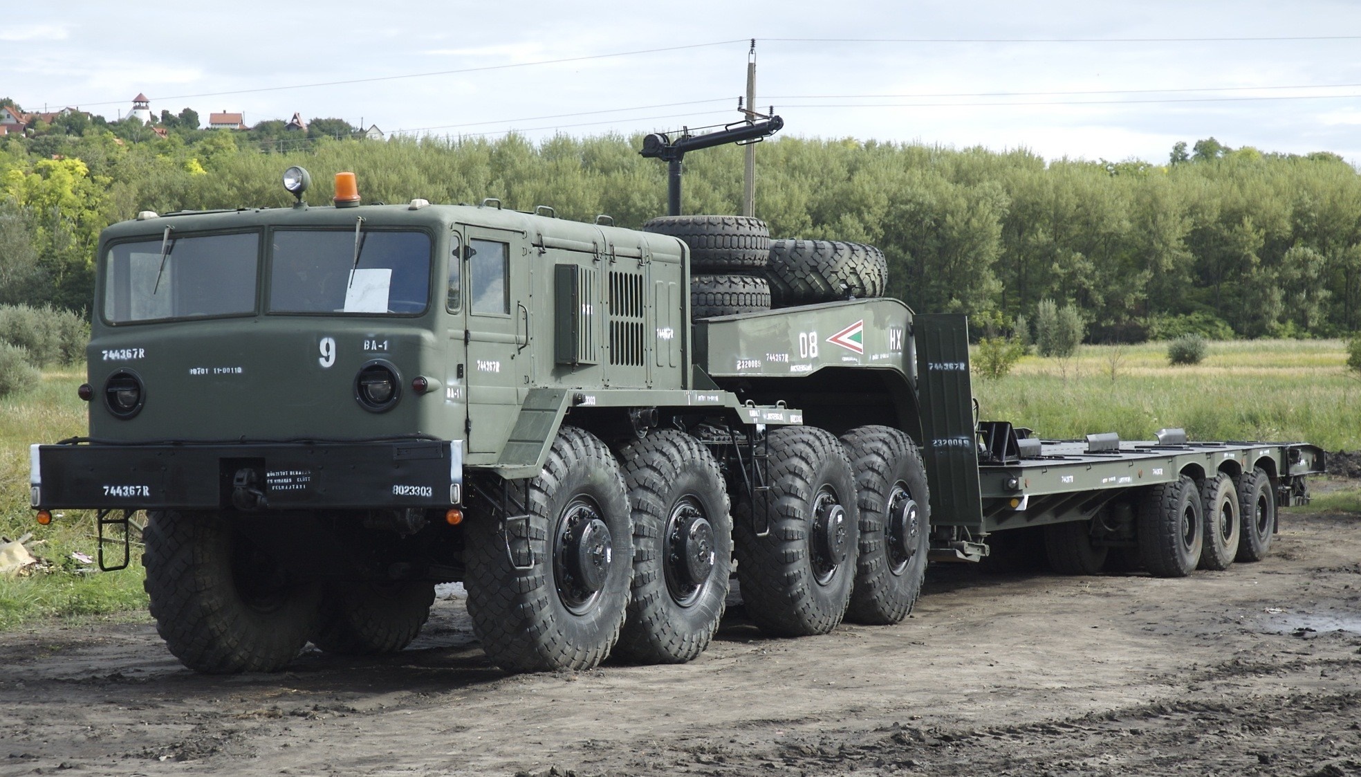 Military truck with trailer and spare tires HD Wallpaper