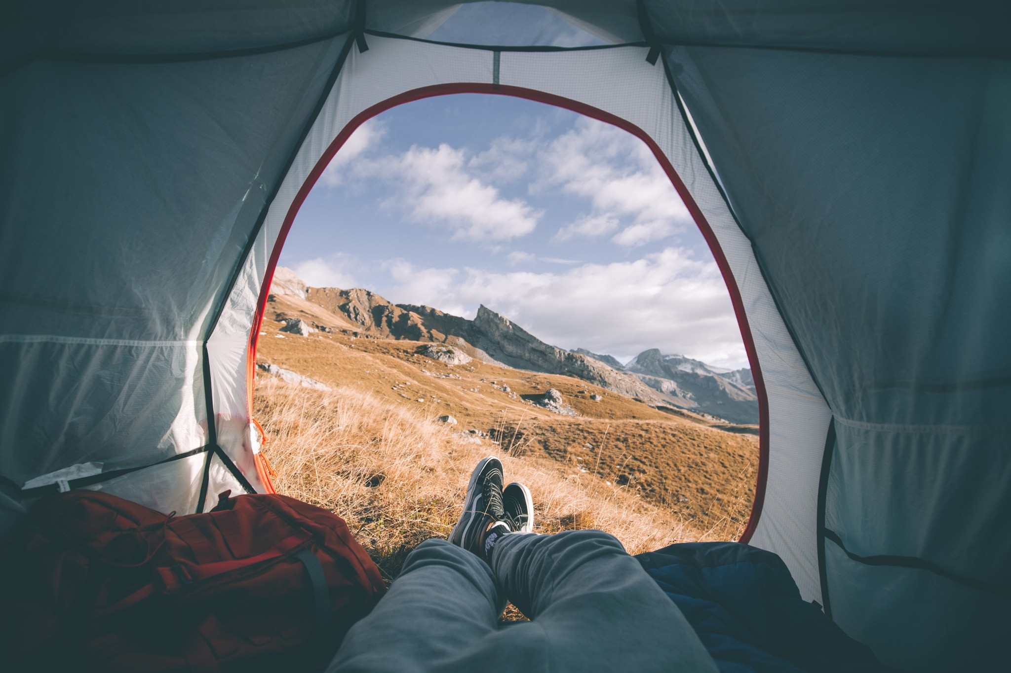View from a tent of mountains and sky HD Wallpaper