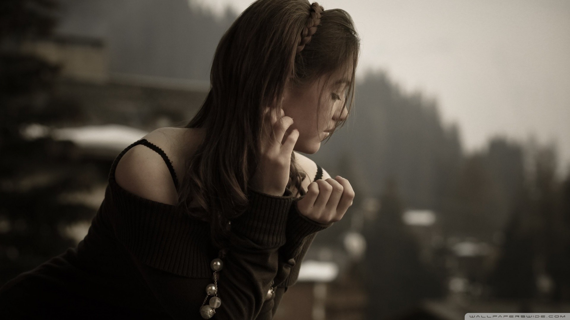 Monochrome portrait of a young woman with her hands near her face HD Wallpaper
