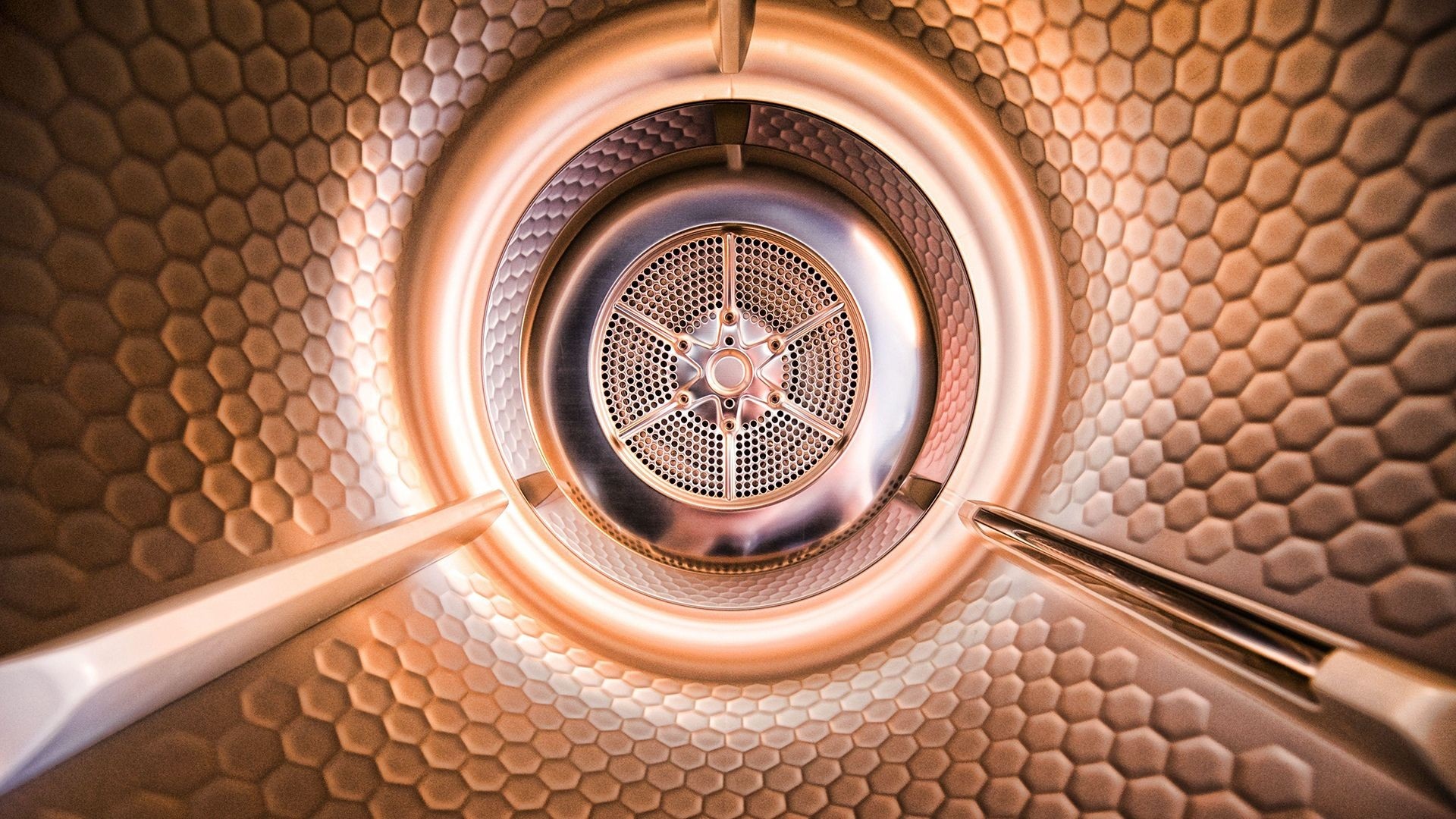 Inside of a dryer drum with honeycomb pattern HD Wallpaper