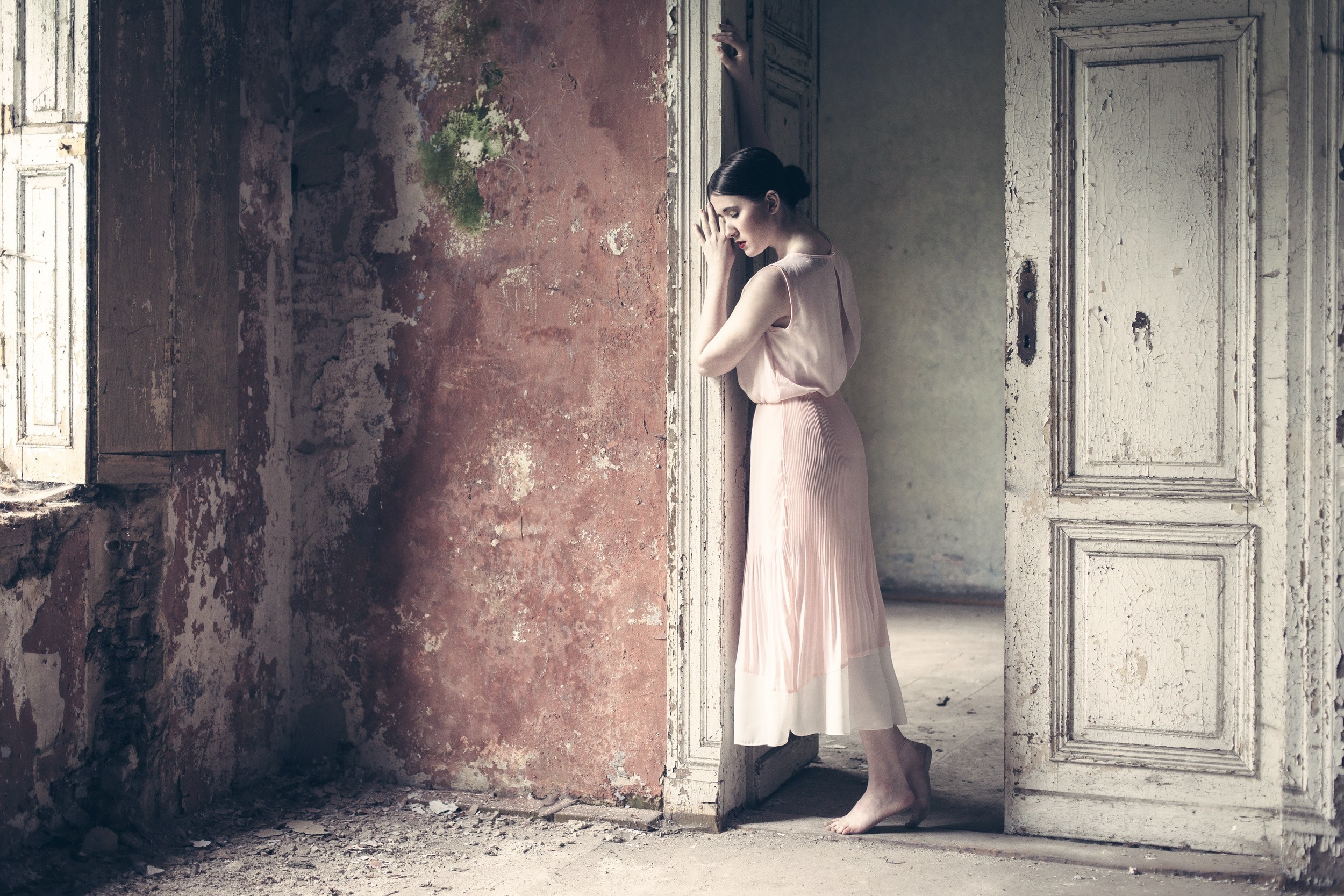 Woman in pink dress in ruined room with open door HD Wallpaper