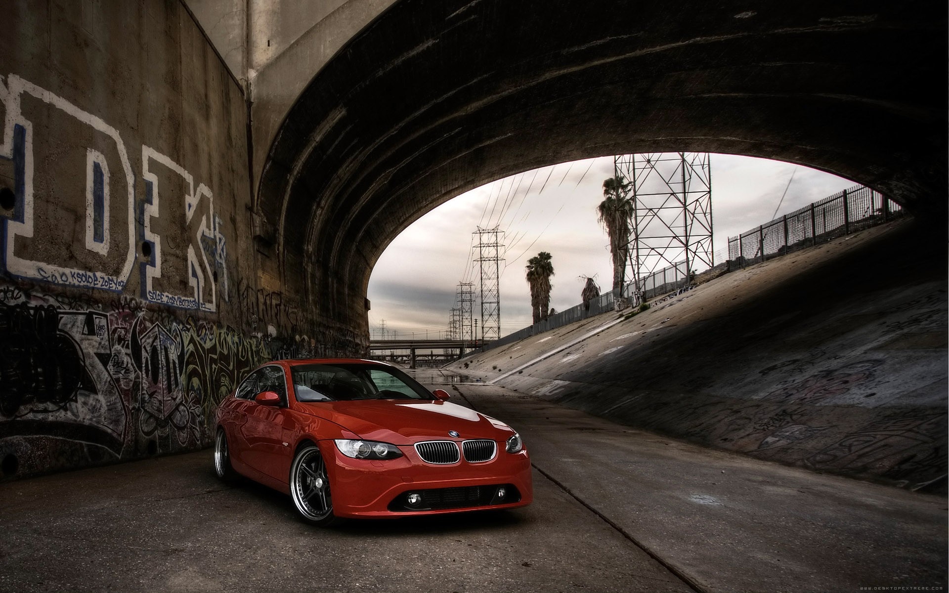 Red BMW E92 sports car under a bridge with graffiti HD Wallpaper