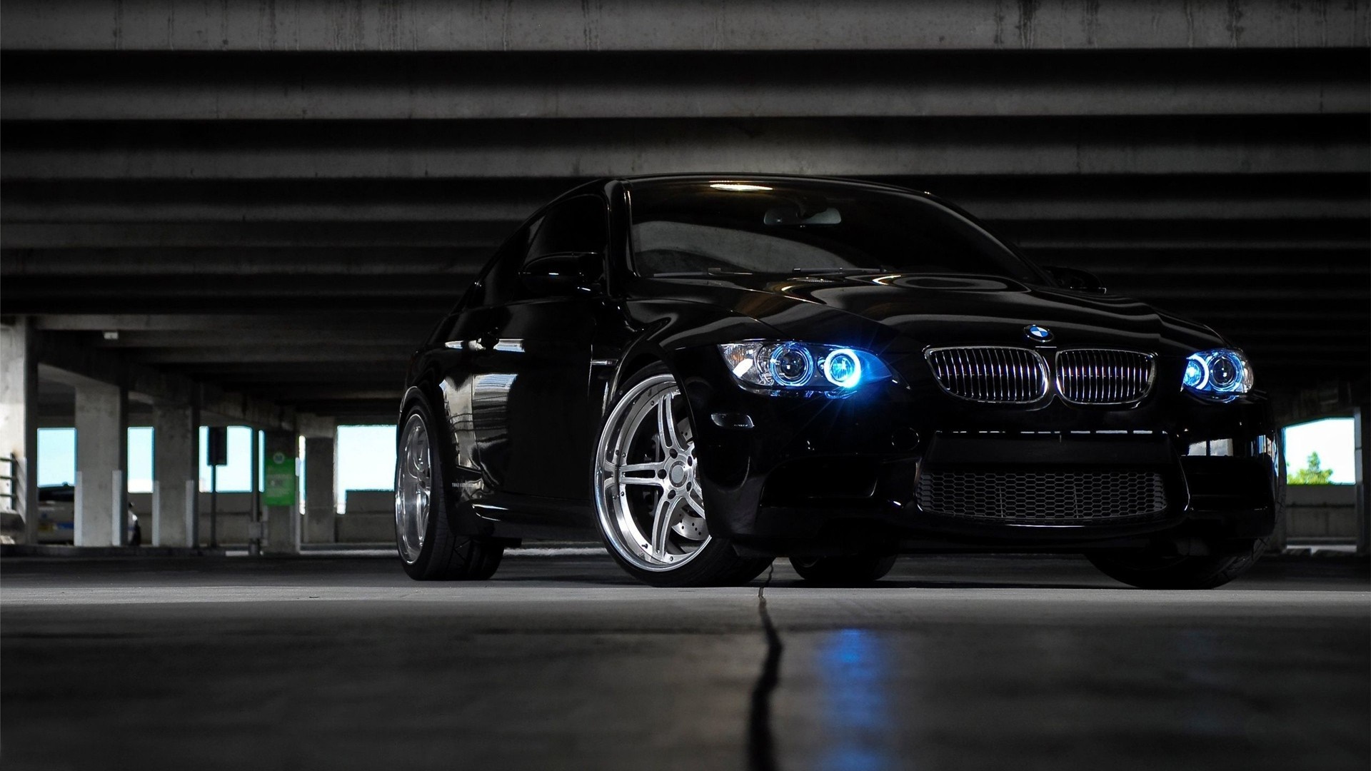 Black BMW M3 parked in a concrete structure HD Wallpaper