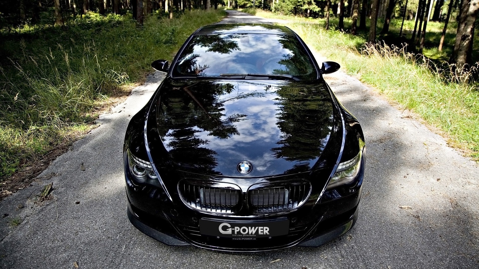 Black BMW M6 Hurricane RR parked on a forest road HD Wallpaper