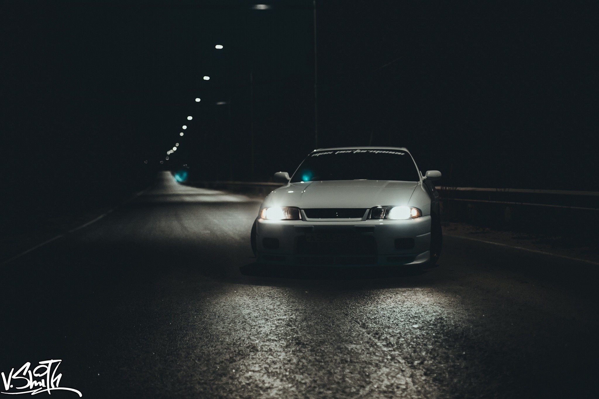 White sports car driving on a dark road at night HD Wallpaper