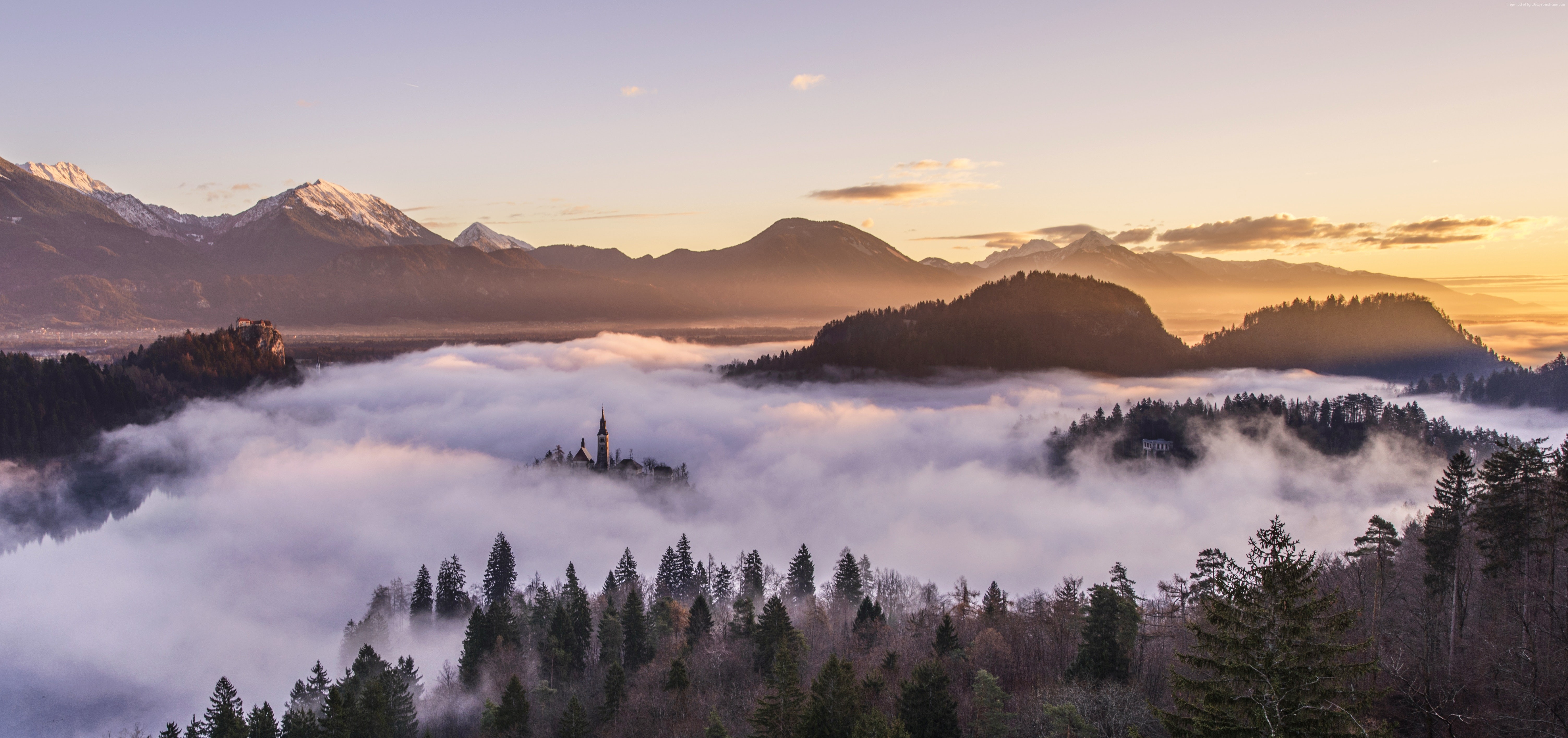 Church on island in fog with mountains and sunrise HD Wallpaper