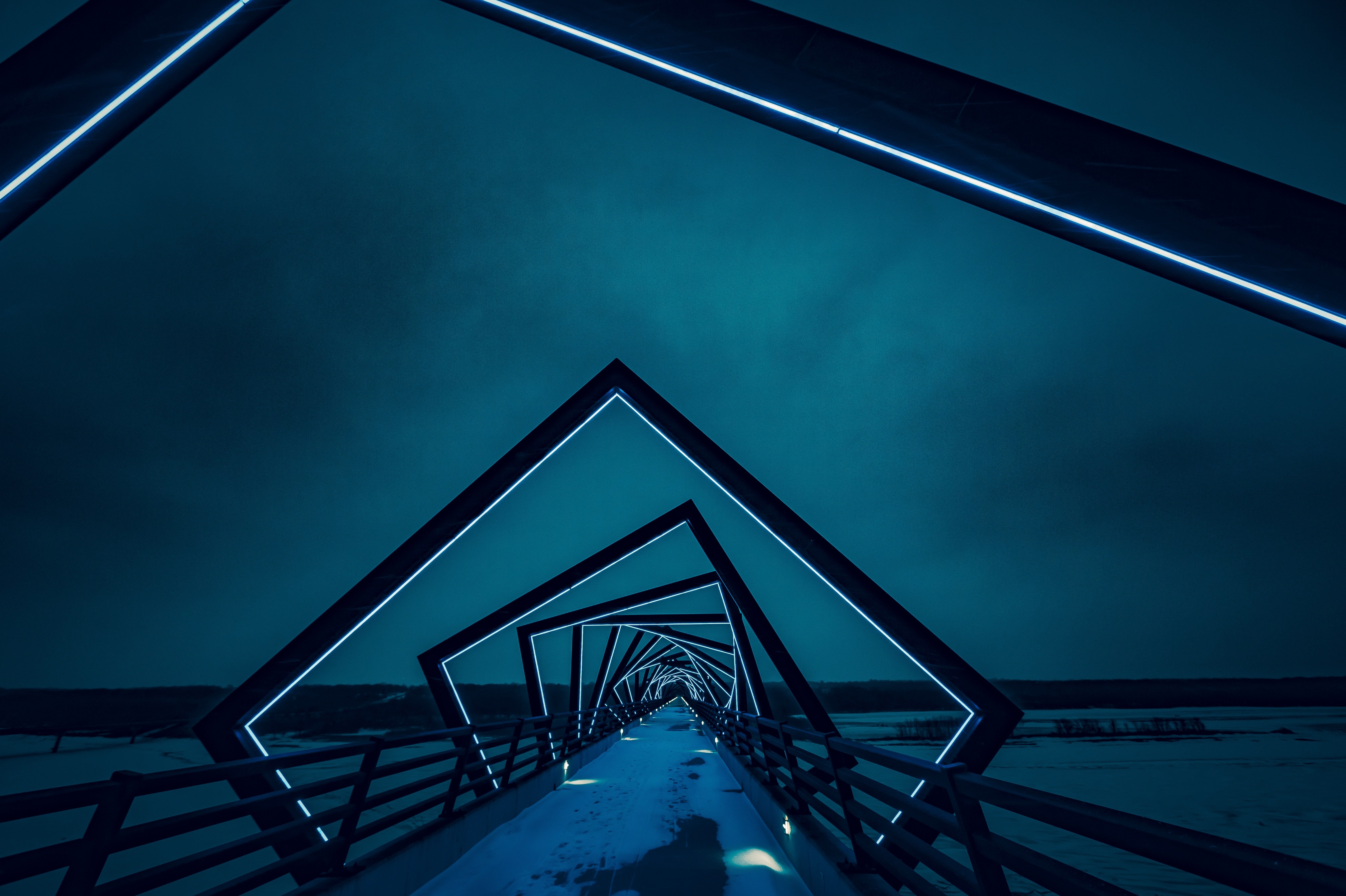 Geometric bridge with blue lights at night HD Wallpaper