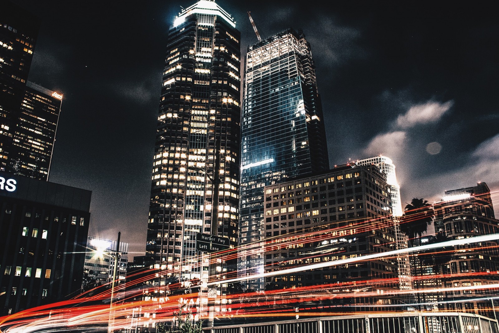 Cityscape at night with light trails from traffic HD Wallpaper
