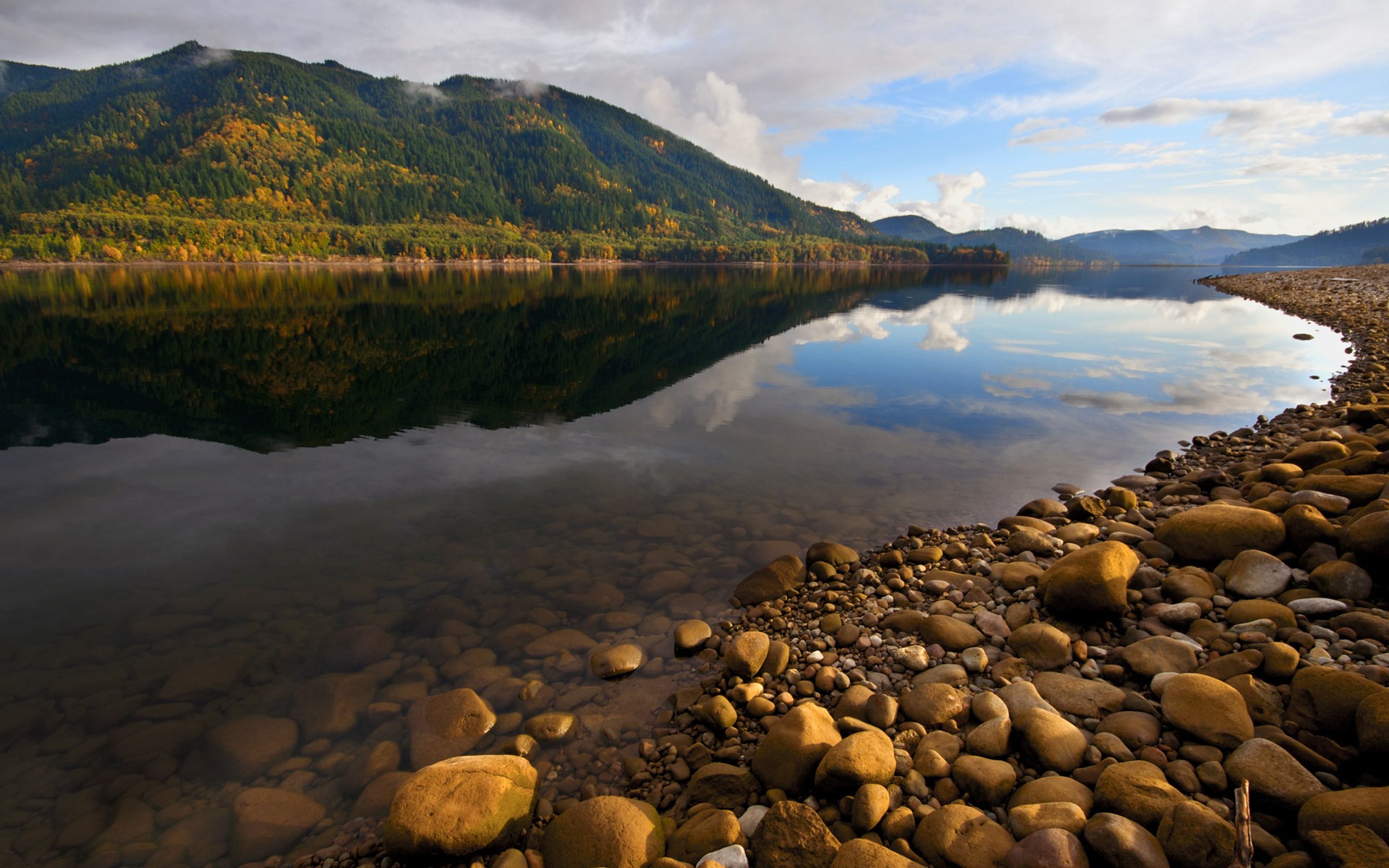 Mountain lake with reflection and rocky shore HD Wallpaper