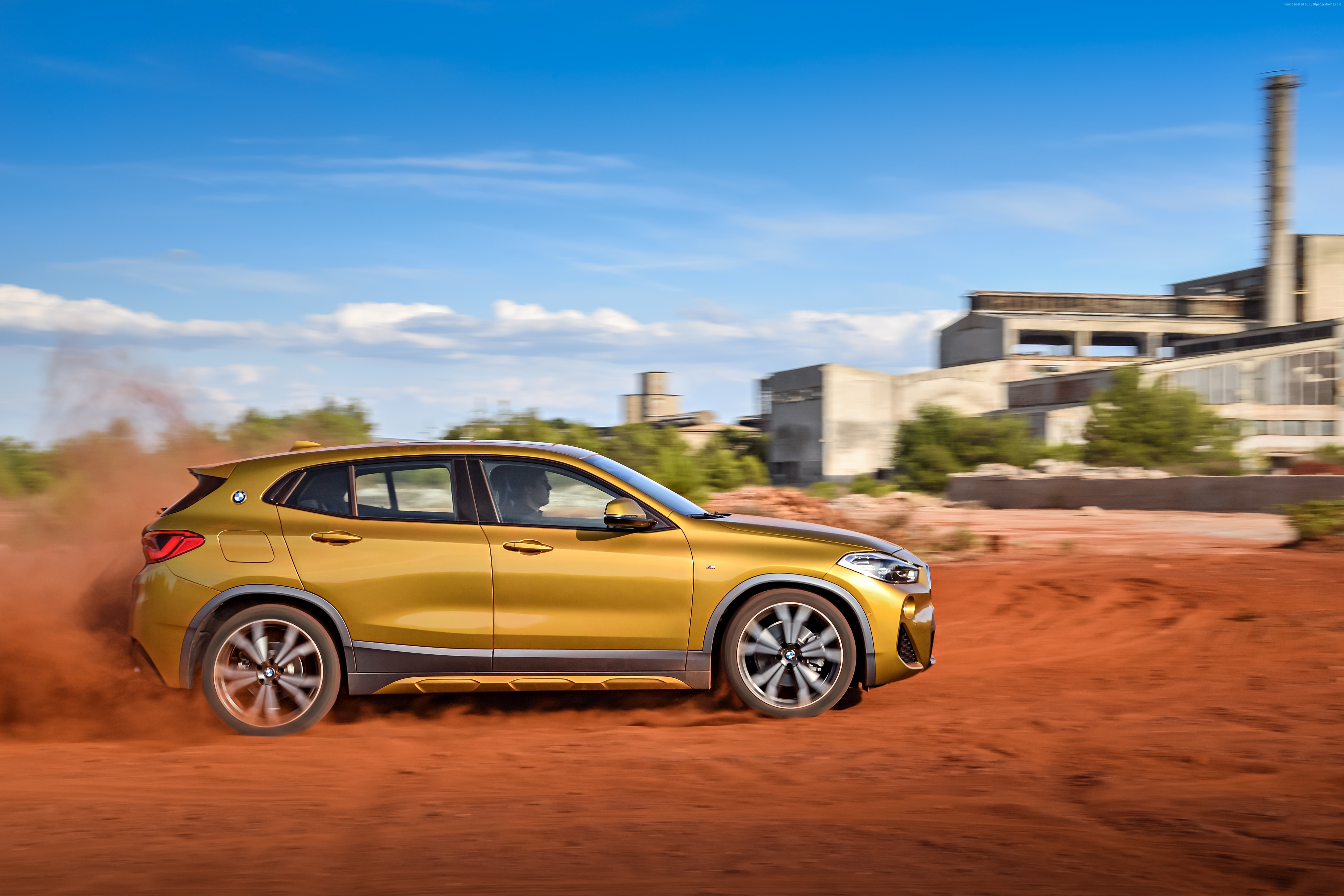 2018 BMW X2 driving on dirt road HD Wallpaper