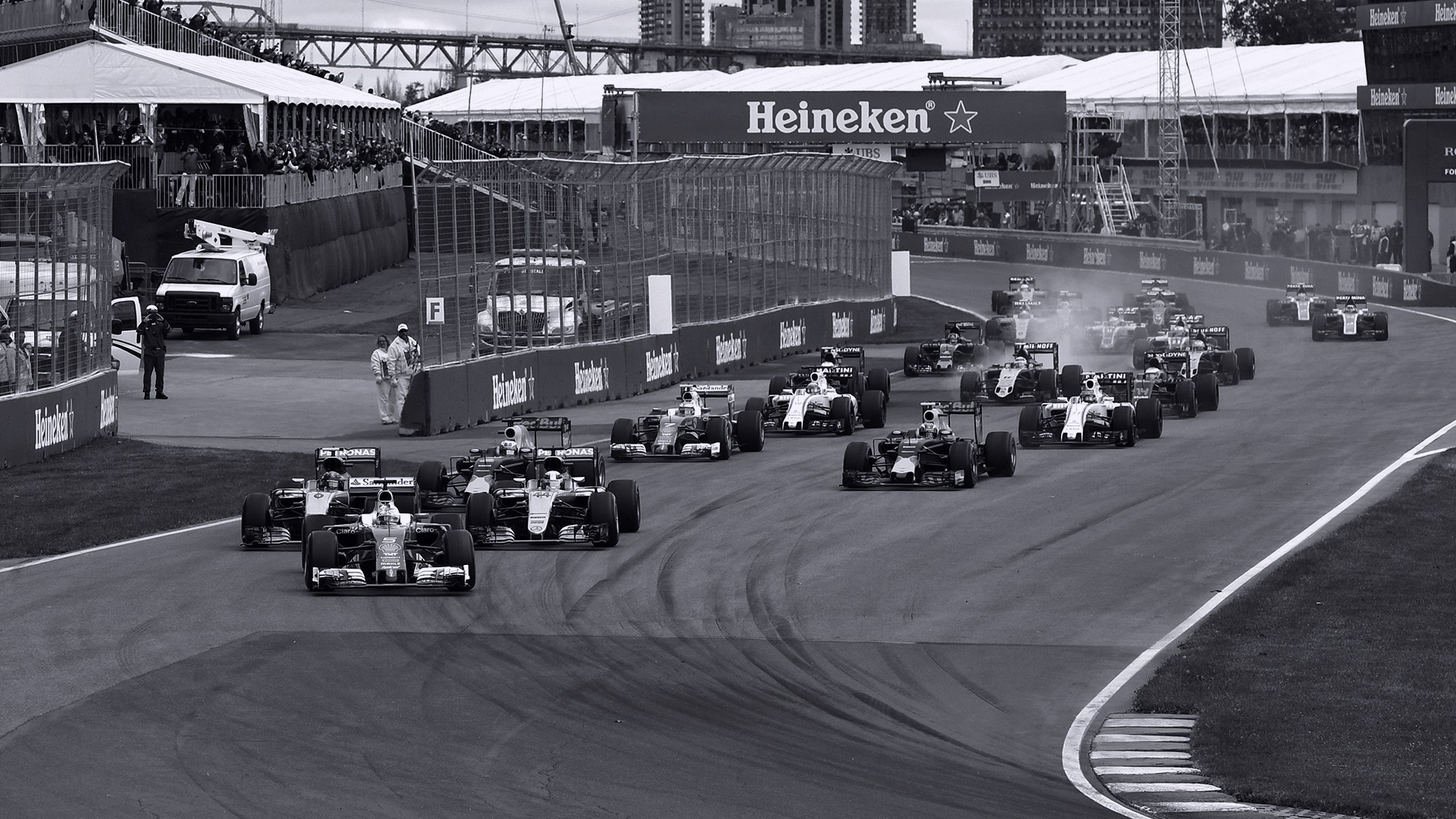 Formula 1 Race Cars on Track with Heineken Branding HD Wallpaper