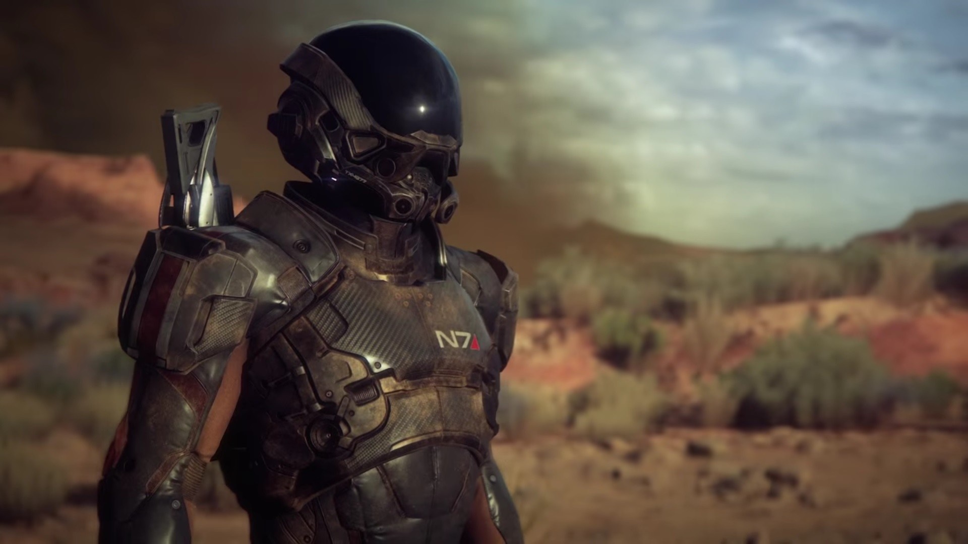 Soldier in N7 armor from Mass Effect in a desert landscape HD Wallpaper