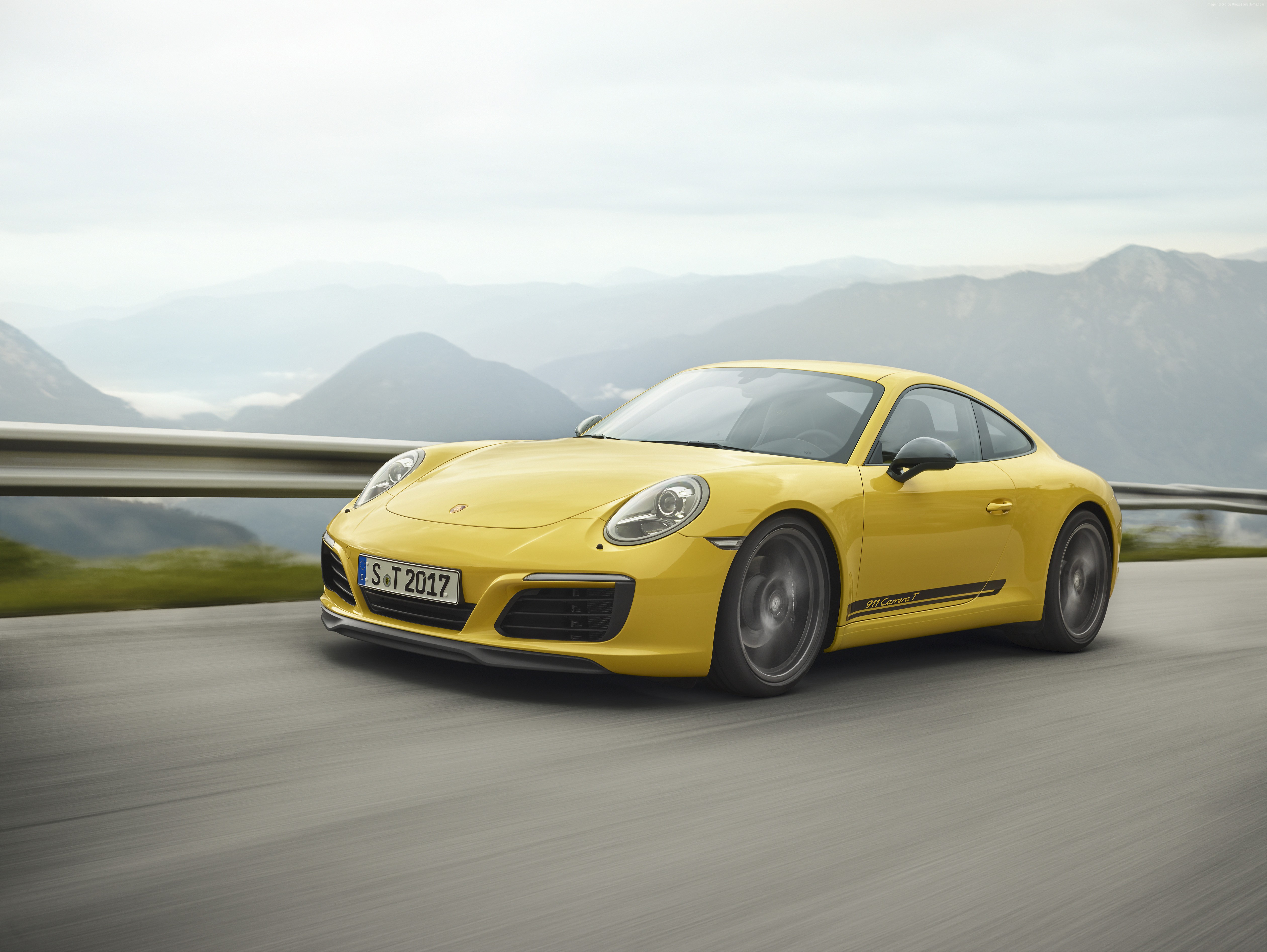 Yellow Porsche 911 Carrera T driving on a mountain road HD Wallpaper
