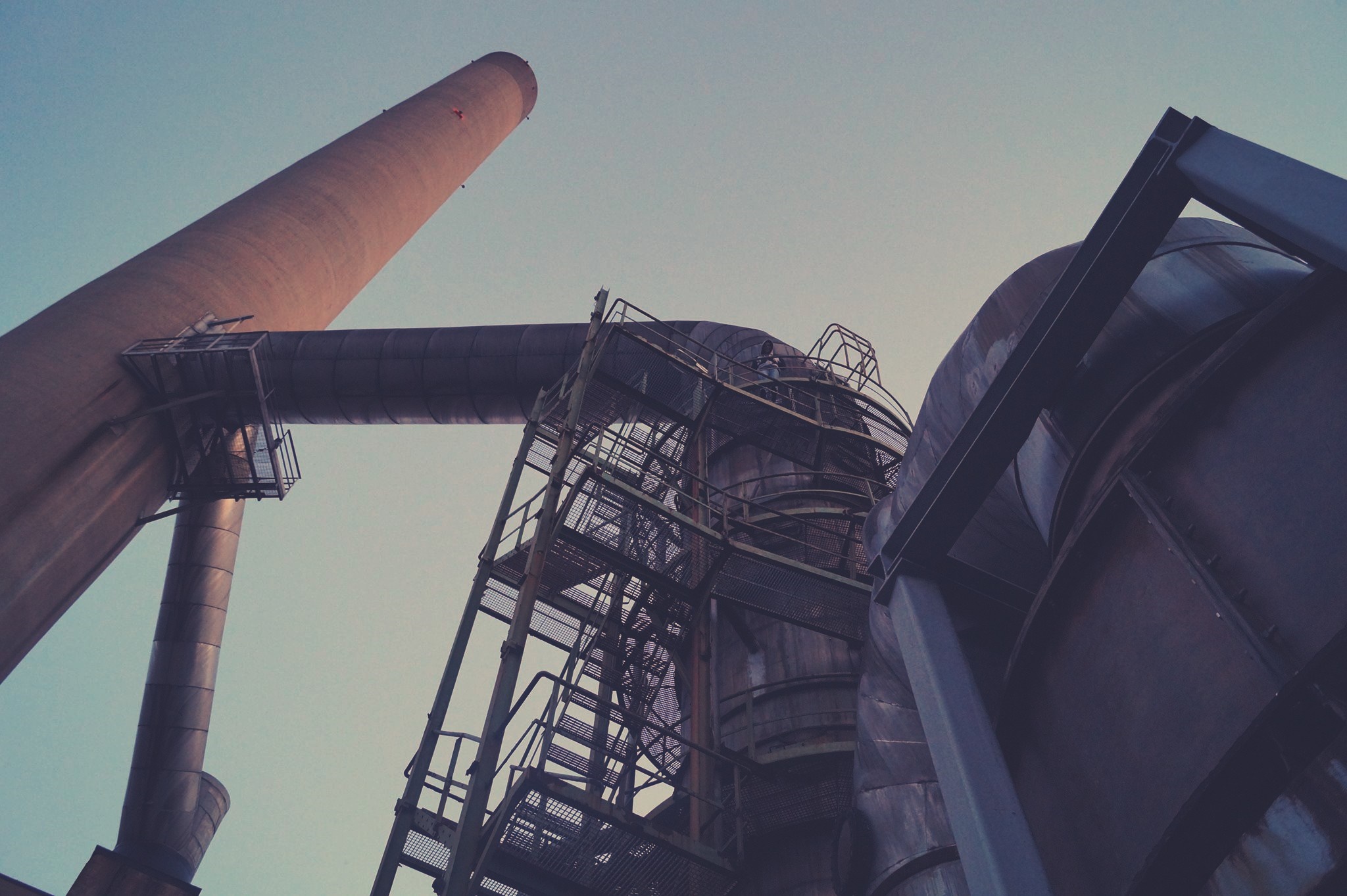 Industrial smokestack and pipes against the sky HD Wallpaper