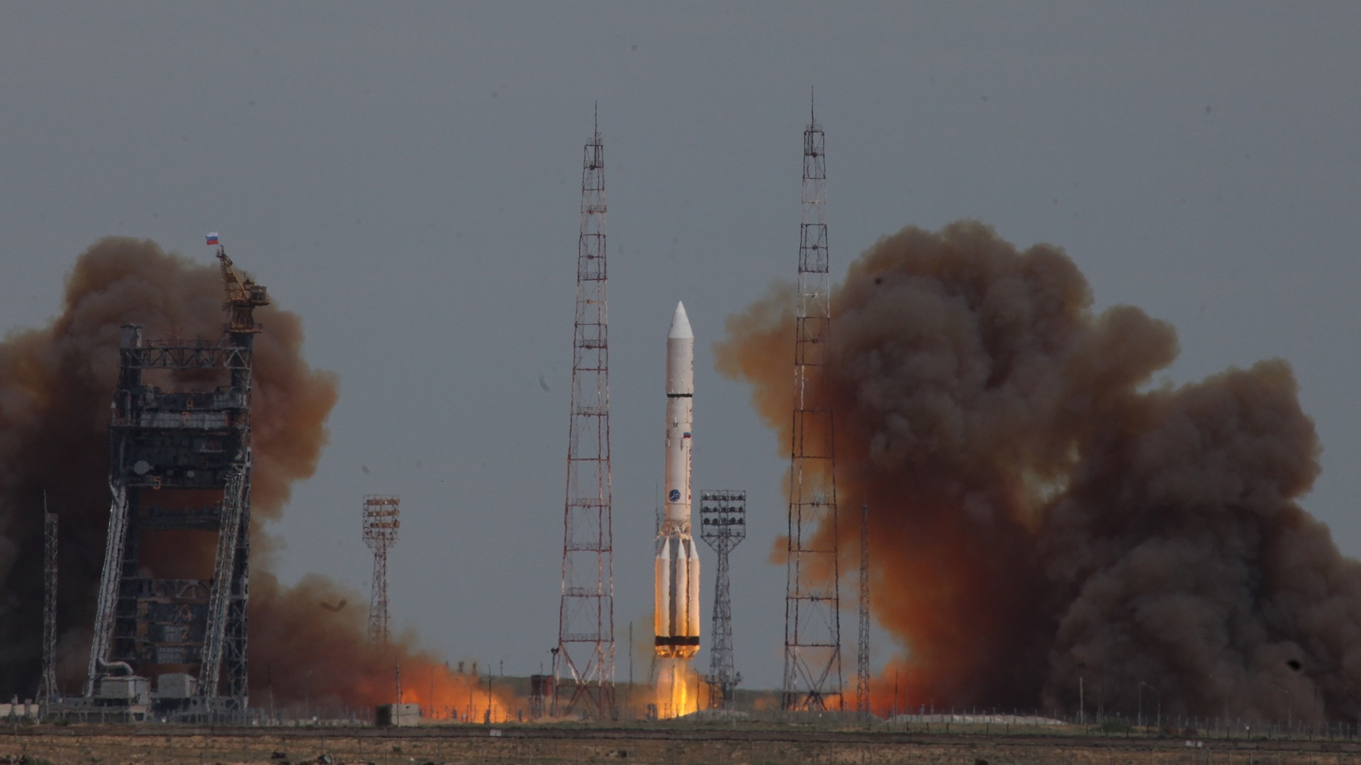 Rocket Launch with Smoke Plumes at Baikonur Cosmodrome HD Wallpaper