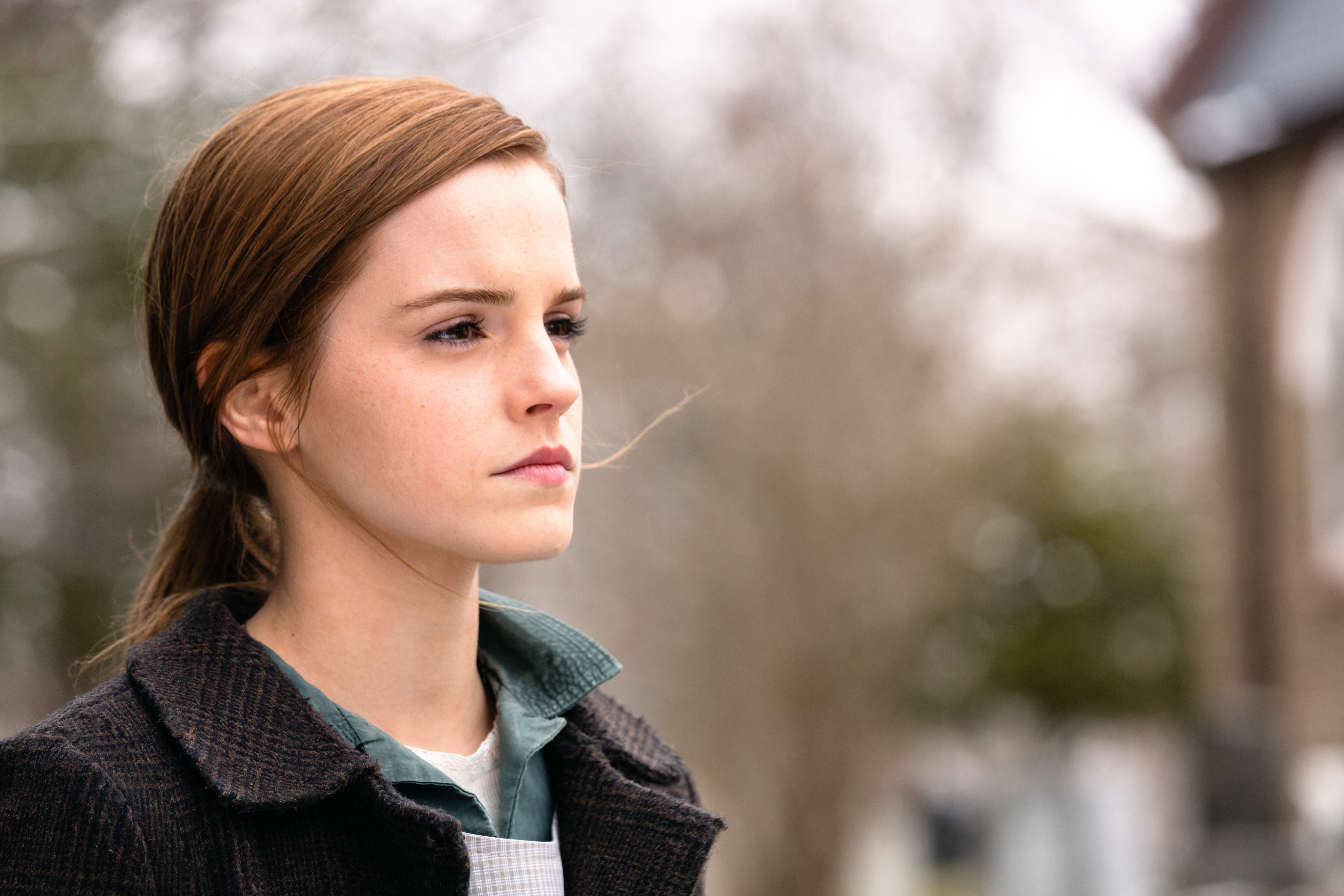 Emma Watson in a dark coat and apron HD Wallpaper
