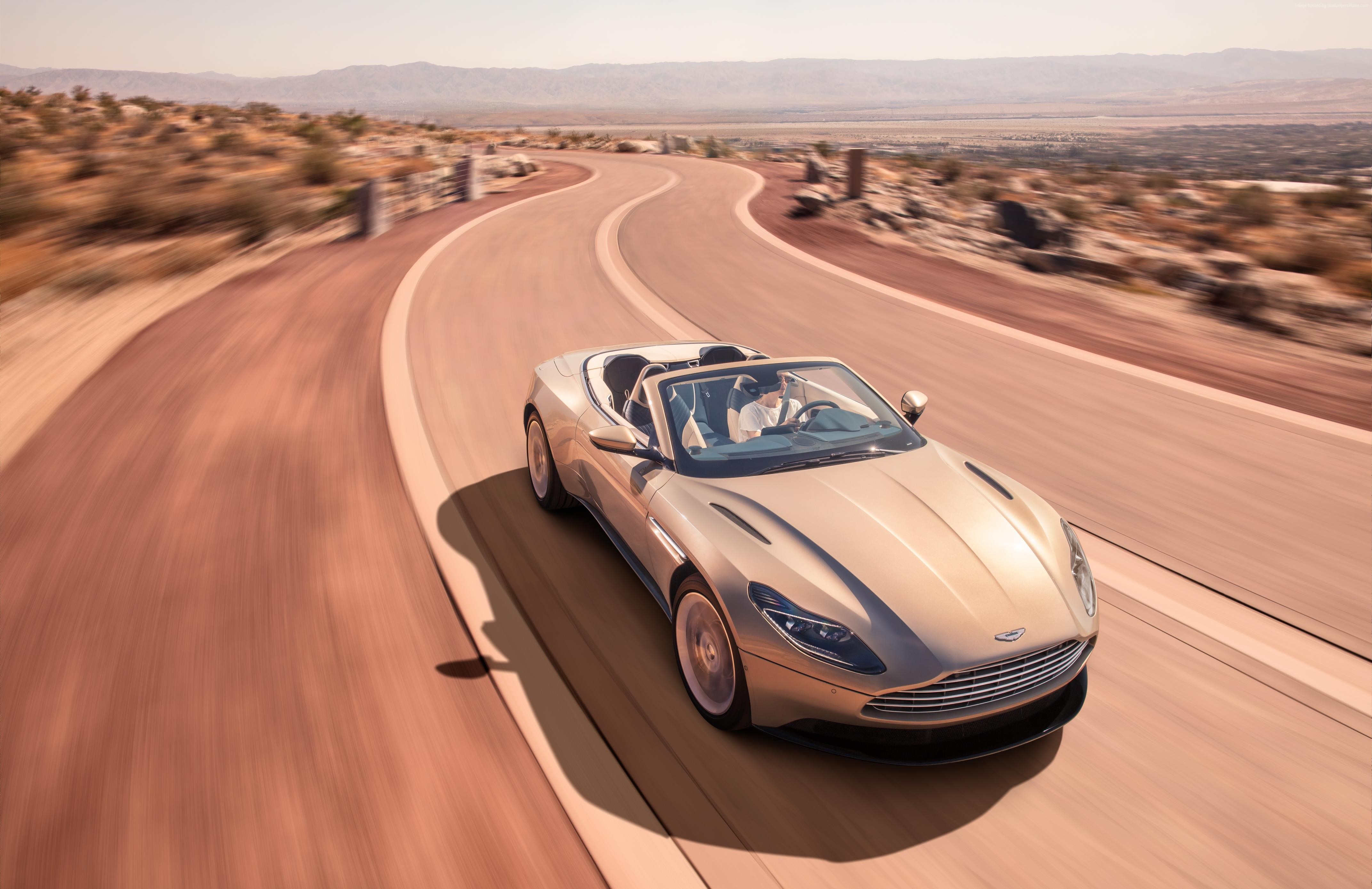 Aston Martin DB11 Volante driving on desert road HD Wallpaper