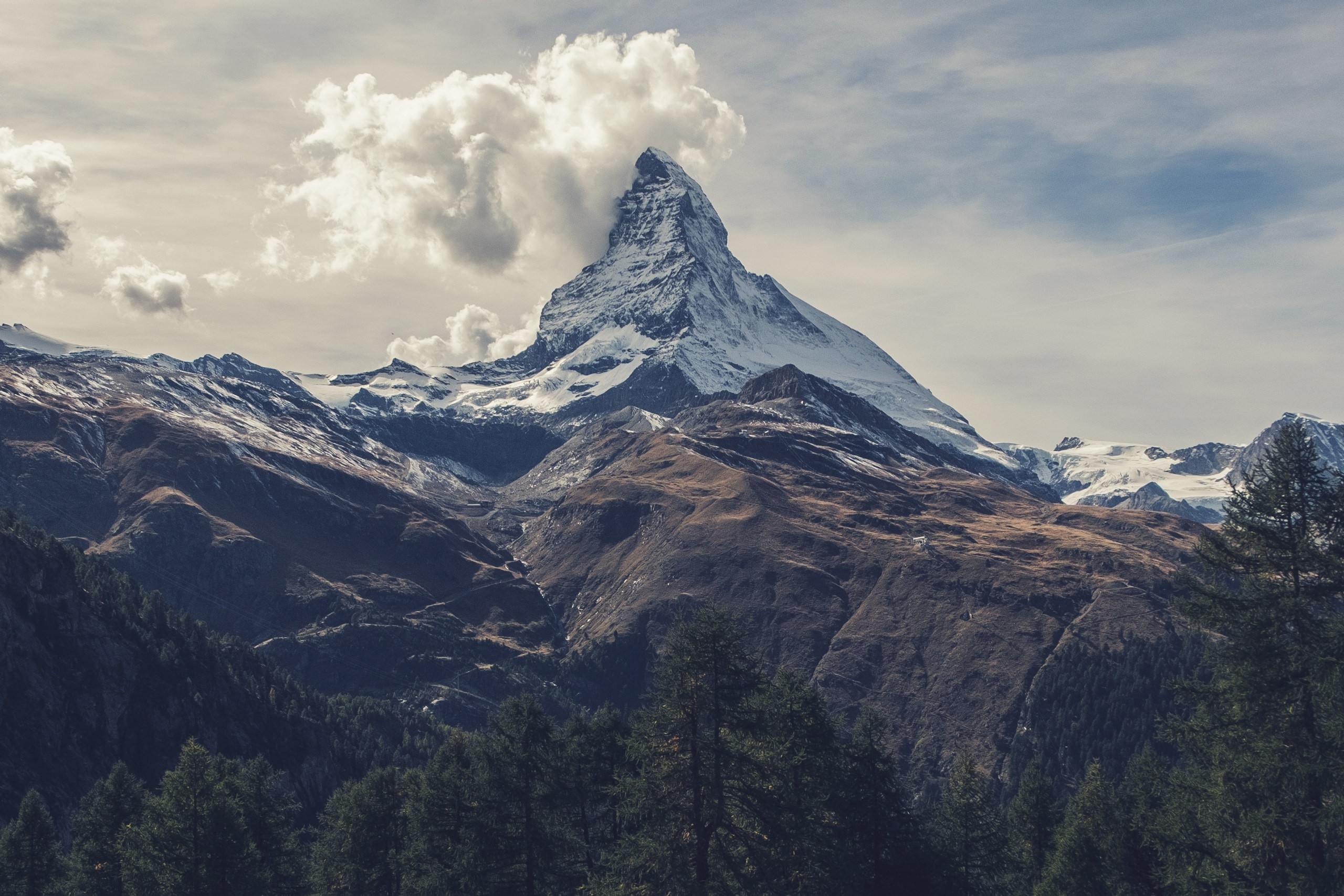 Matterhorn mountain peak with clouds and forest HD Wallpaper