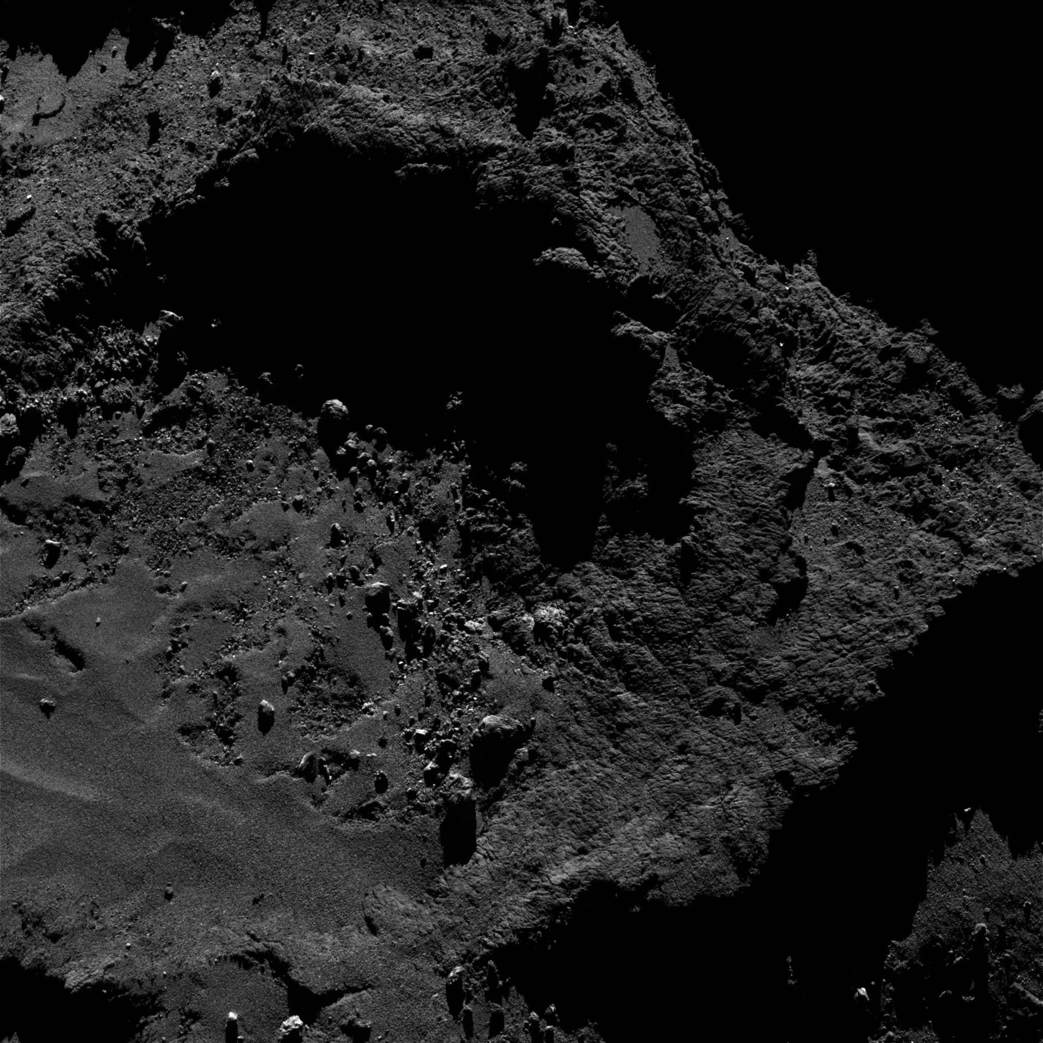 Close-up of a rocky, dark surface from Rosetta mission HD Wallpaper